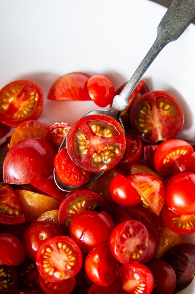Simple Marinated Tomatoes in a white bowl 