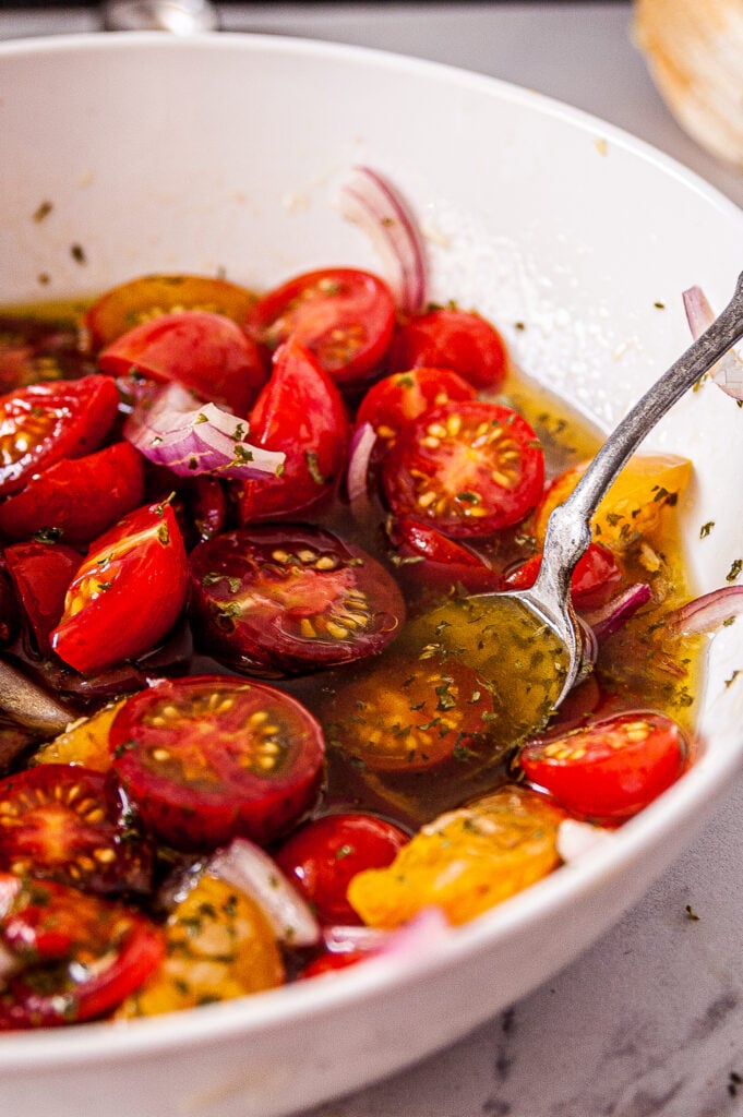 Simple Marinated Tomatoes with spoon