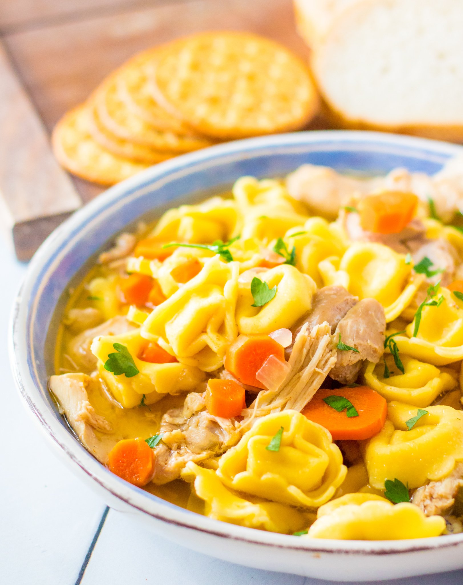 Chicken Tortellini Soup in blue bowl