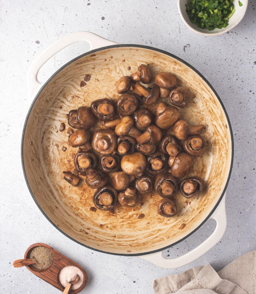 Garlic Sautéed Mushrooms in pot with oil 