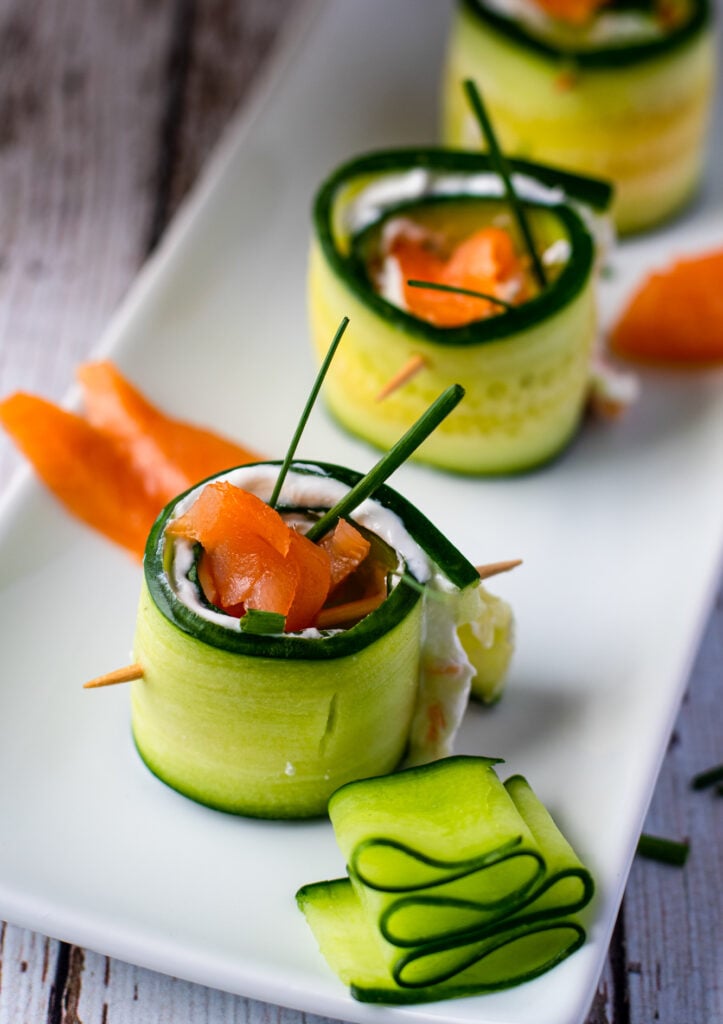 Smoked Salmon Cucumber Appetizer Bites on white platter