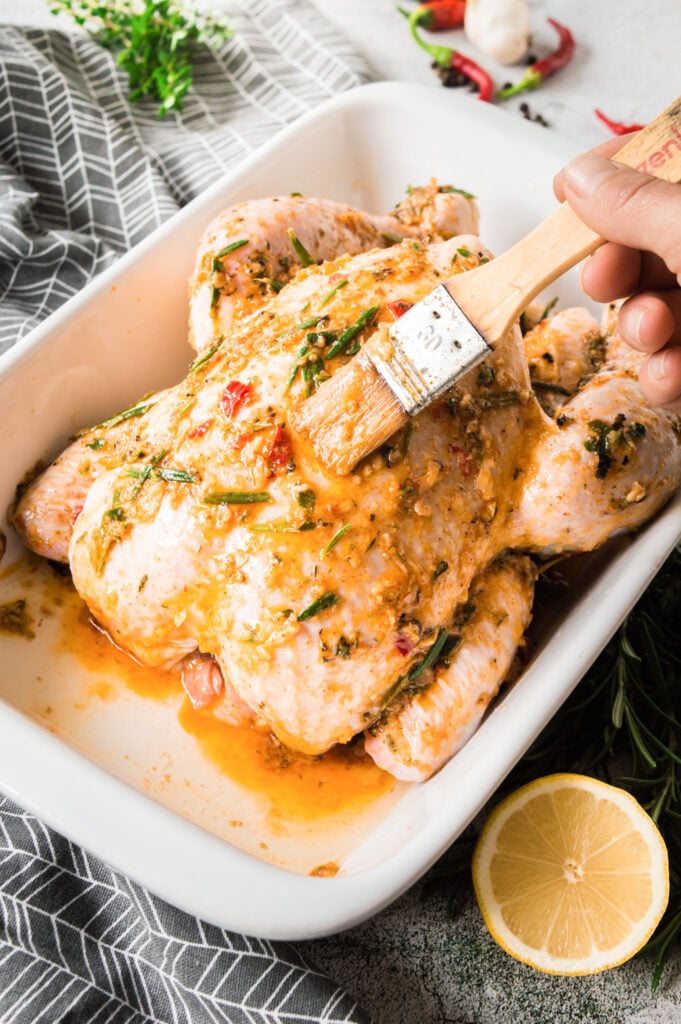 Whole Roasted Chicken with Potatoes with rub on the chicken