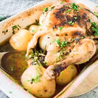 Whole Roasted Chicken with Potatoes in pan