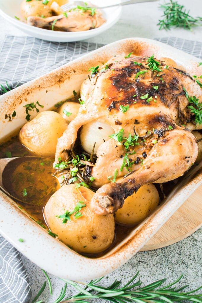 Whole Roasted Chicken with Potatoes in pan