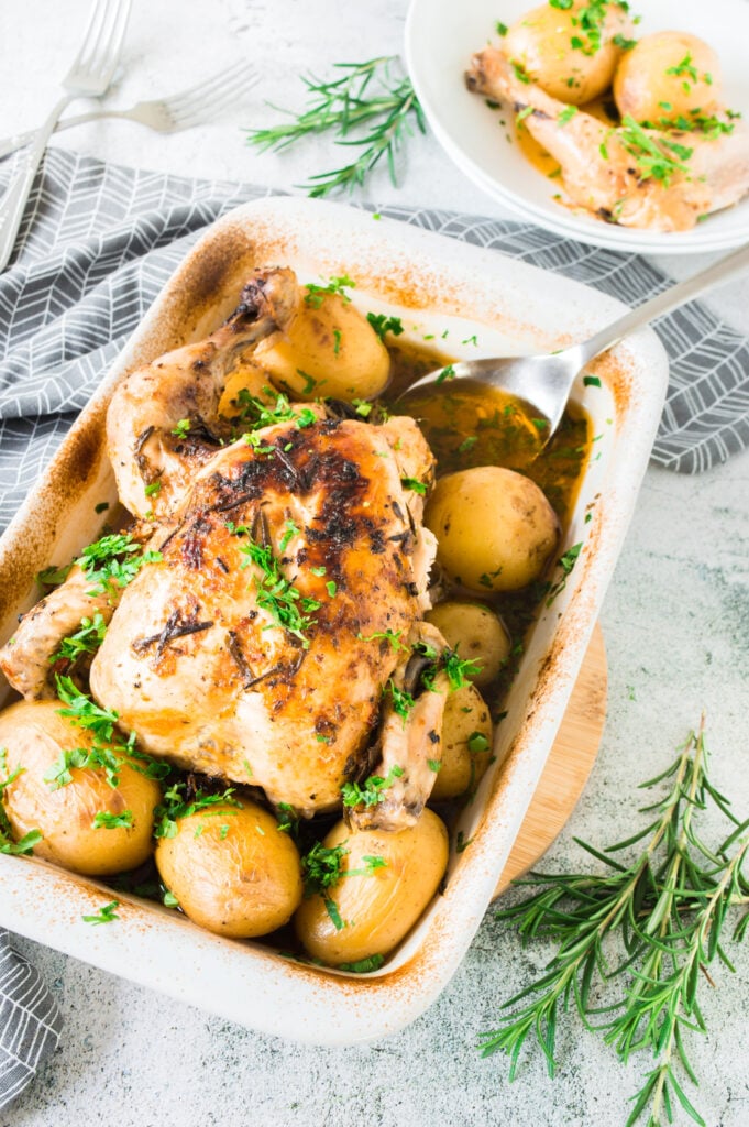Whole Roasted Chicken with Potatoes in pan