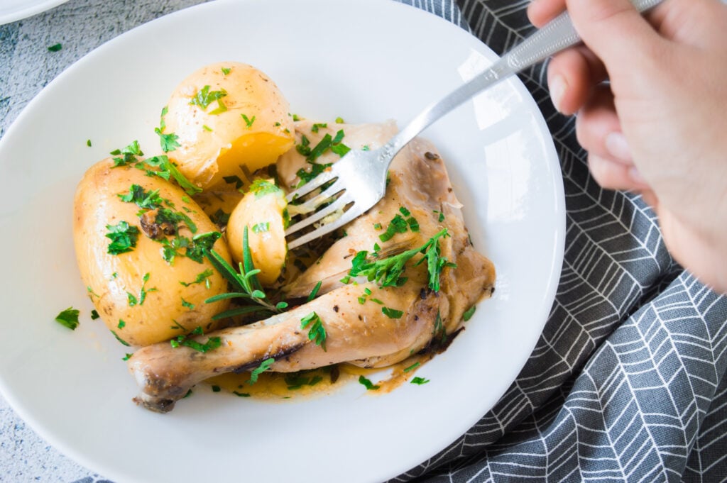 Whole Roasted Chicken with Potatoes with fork