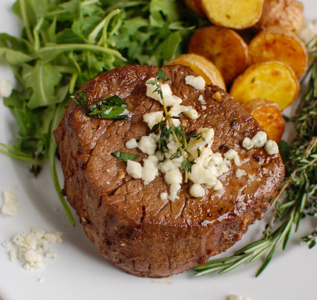 Beef Tenderloin Steaks with Creamy Blue Cheese Sauce with rosemary 