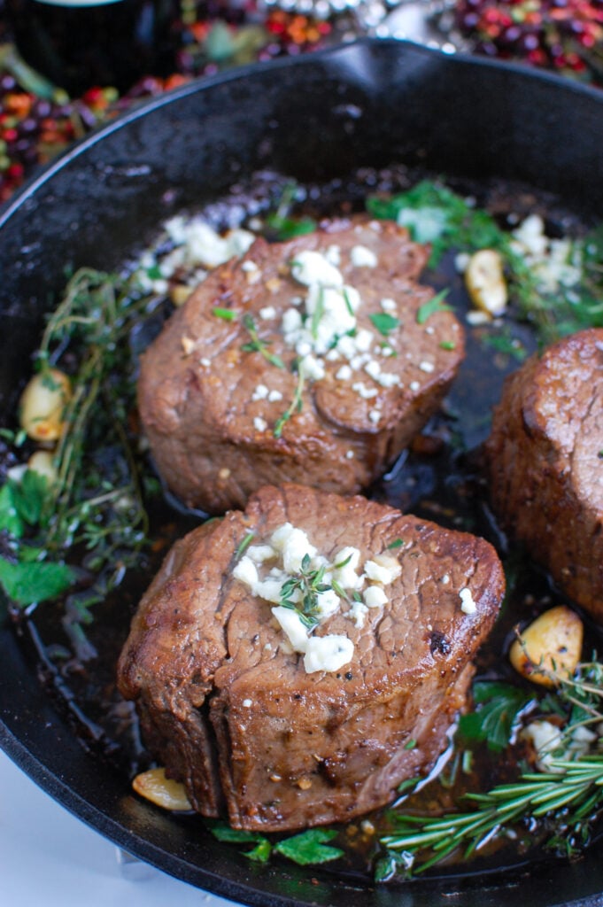 Beef Tenderloin Steaks with Creamy Blue Cheese Sauce in skillet