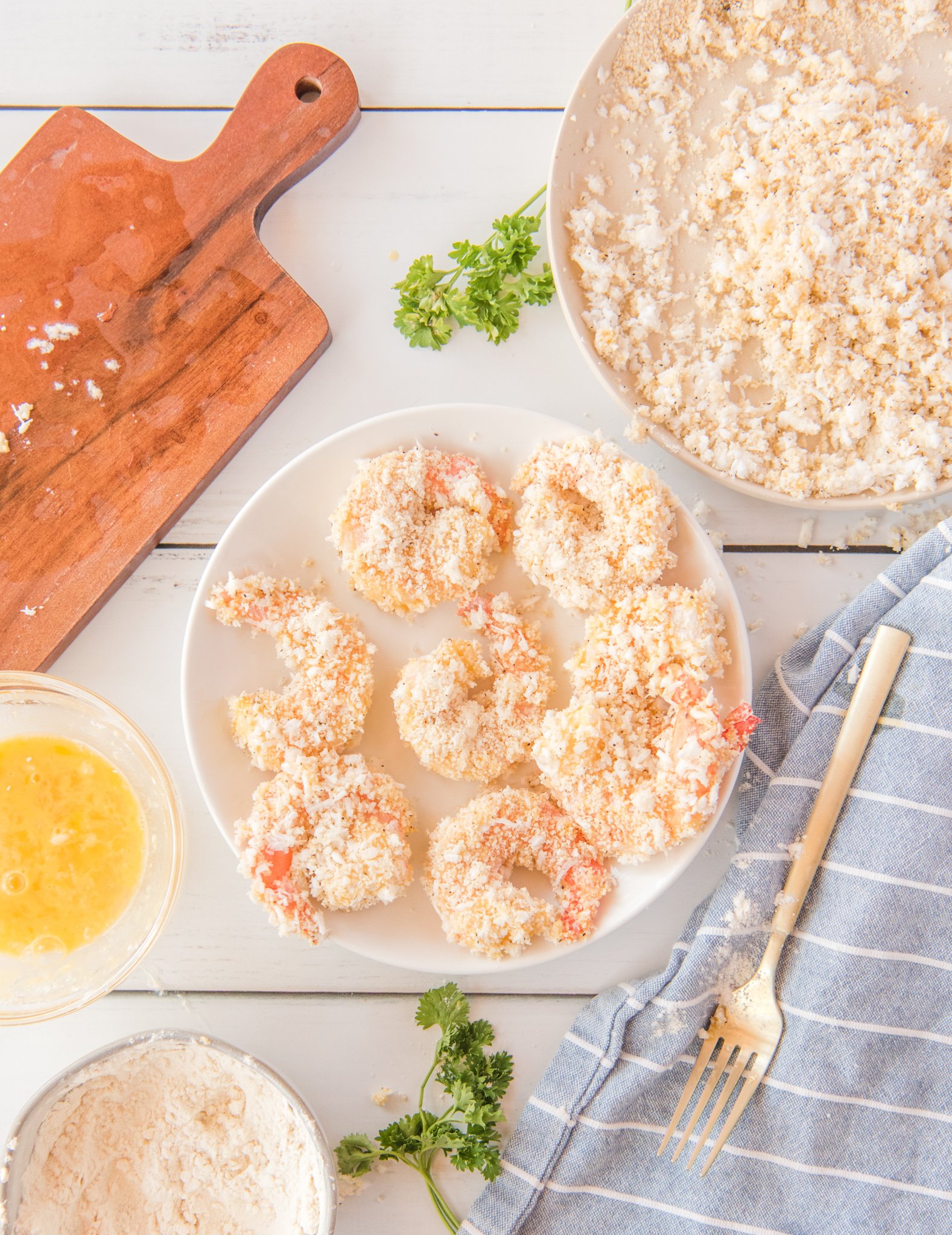 Air Fryer Coconut Shrimp with the shrimp on a plate ready to air fry.