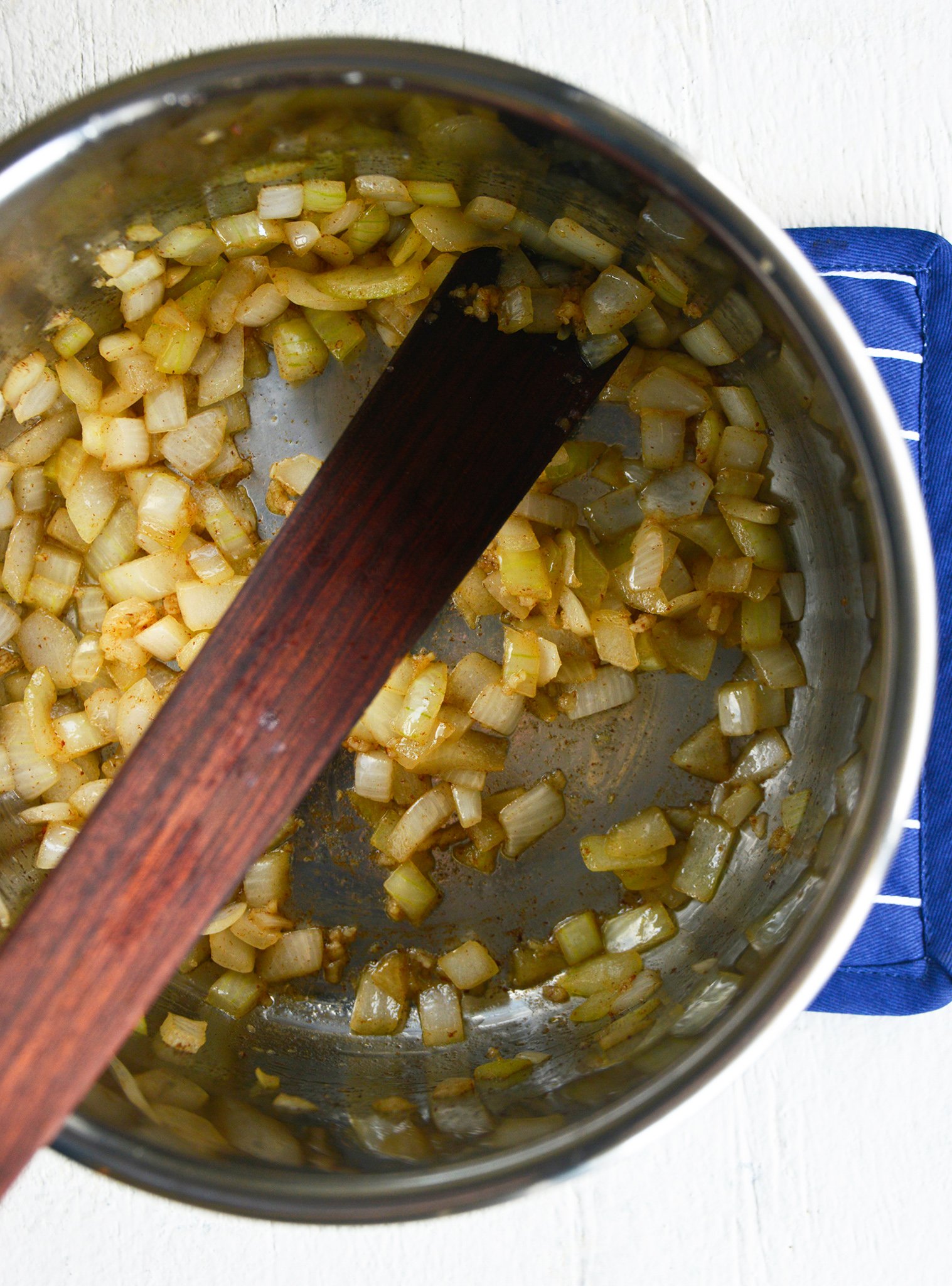 Instant Pot Cauliflower Soup onions in the pressure cooker.