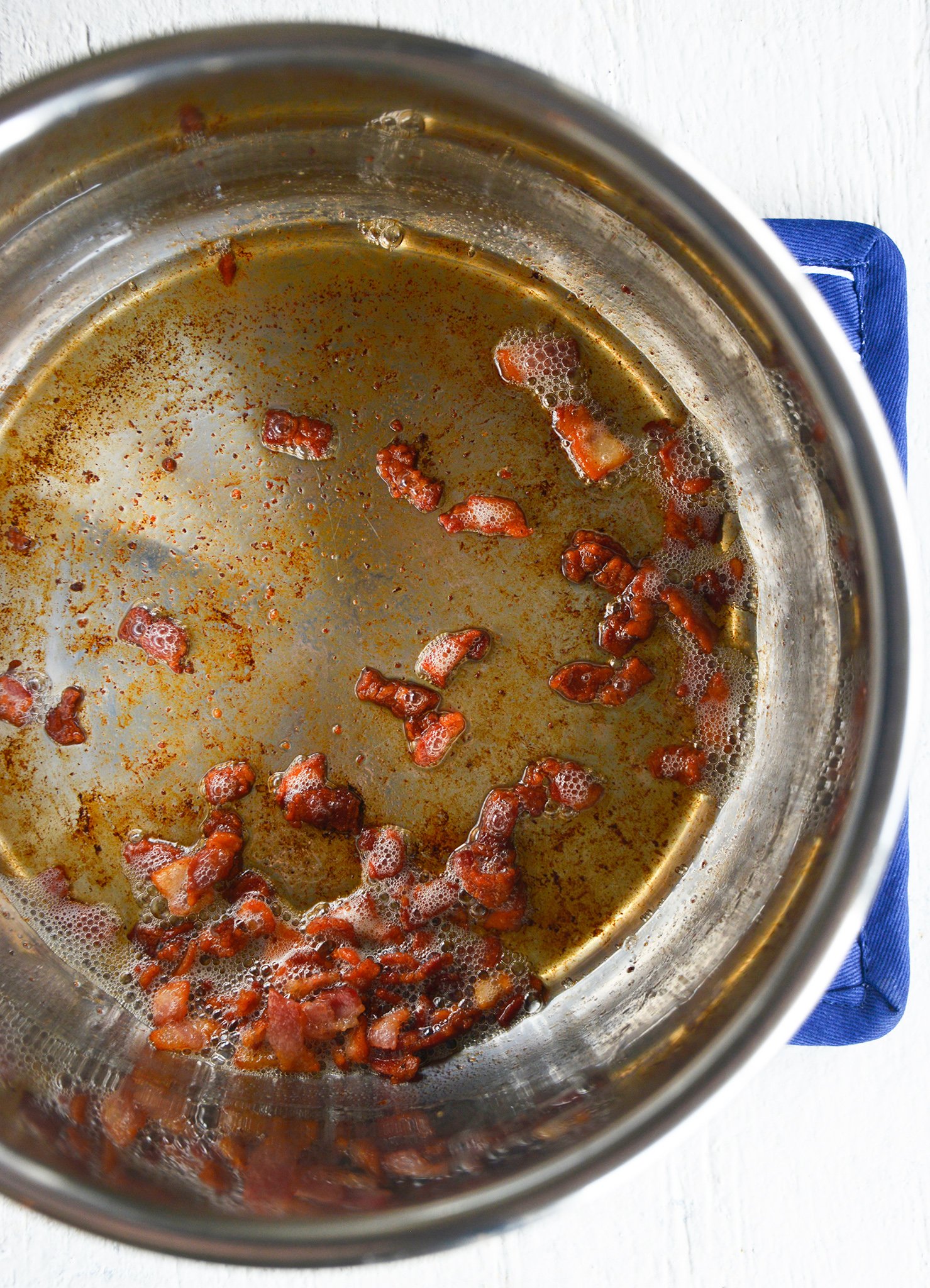 Instant Pot Cauliflower Soup bacon in the pressure cooker.