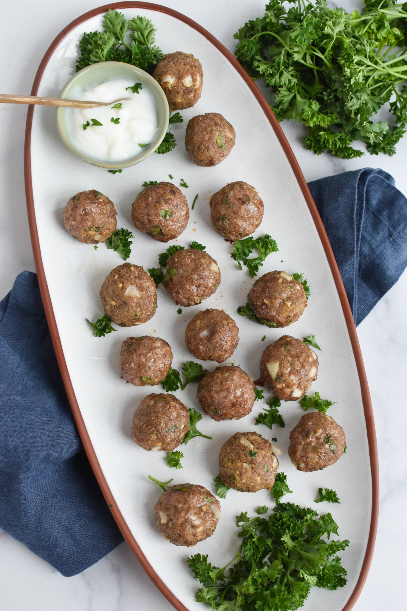 Lamb Kofta on a white platter.