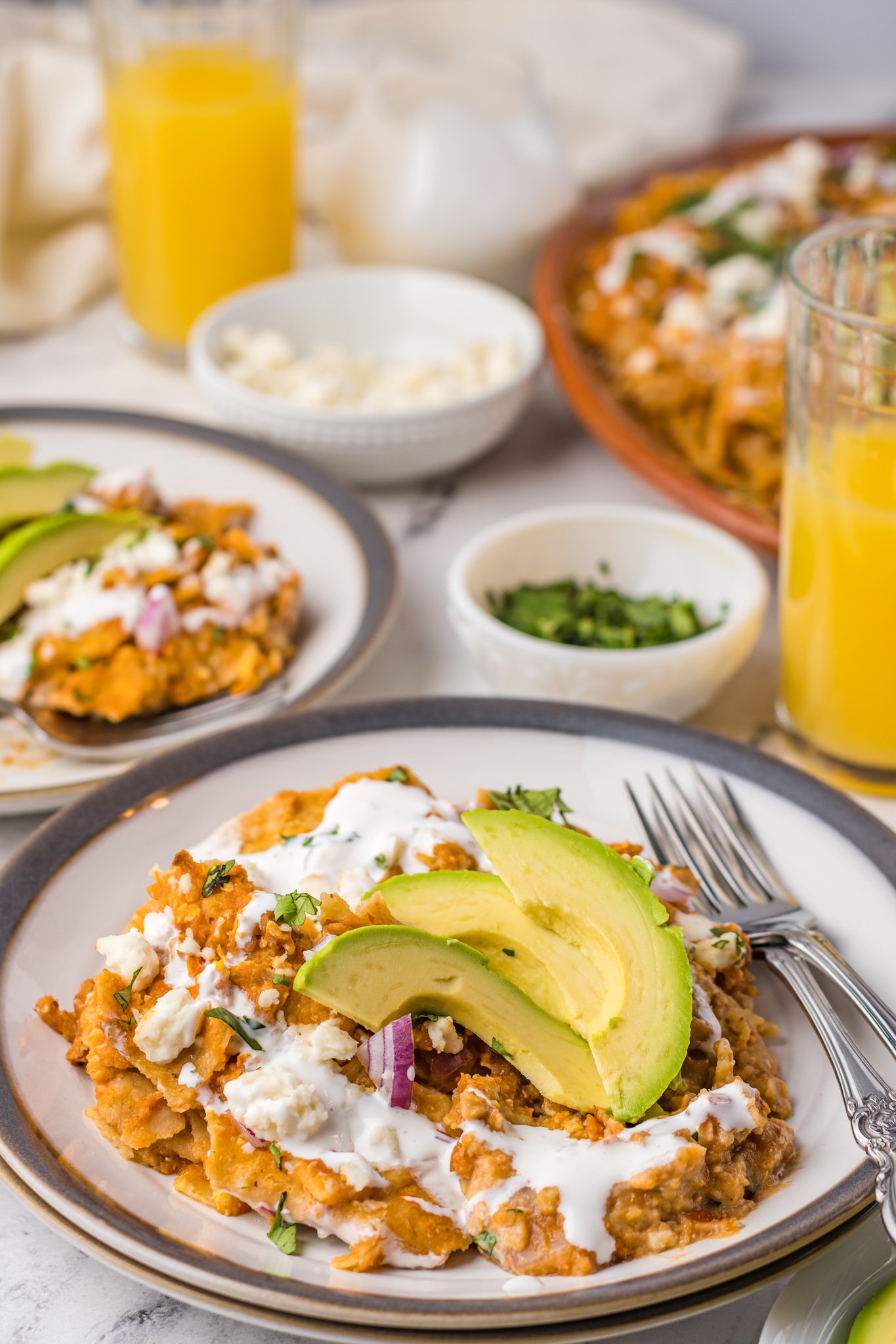 Chilaquiles Rojos on a plate with fork.