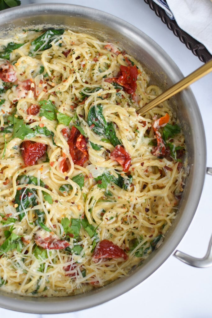 Creamy Sun Dried Tomato Pasta Recipe with spoon 