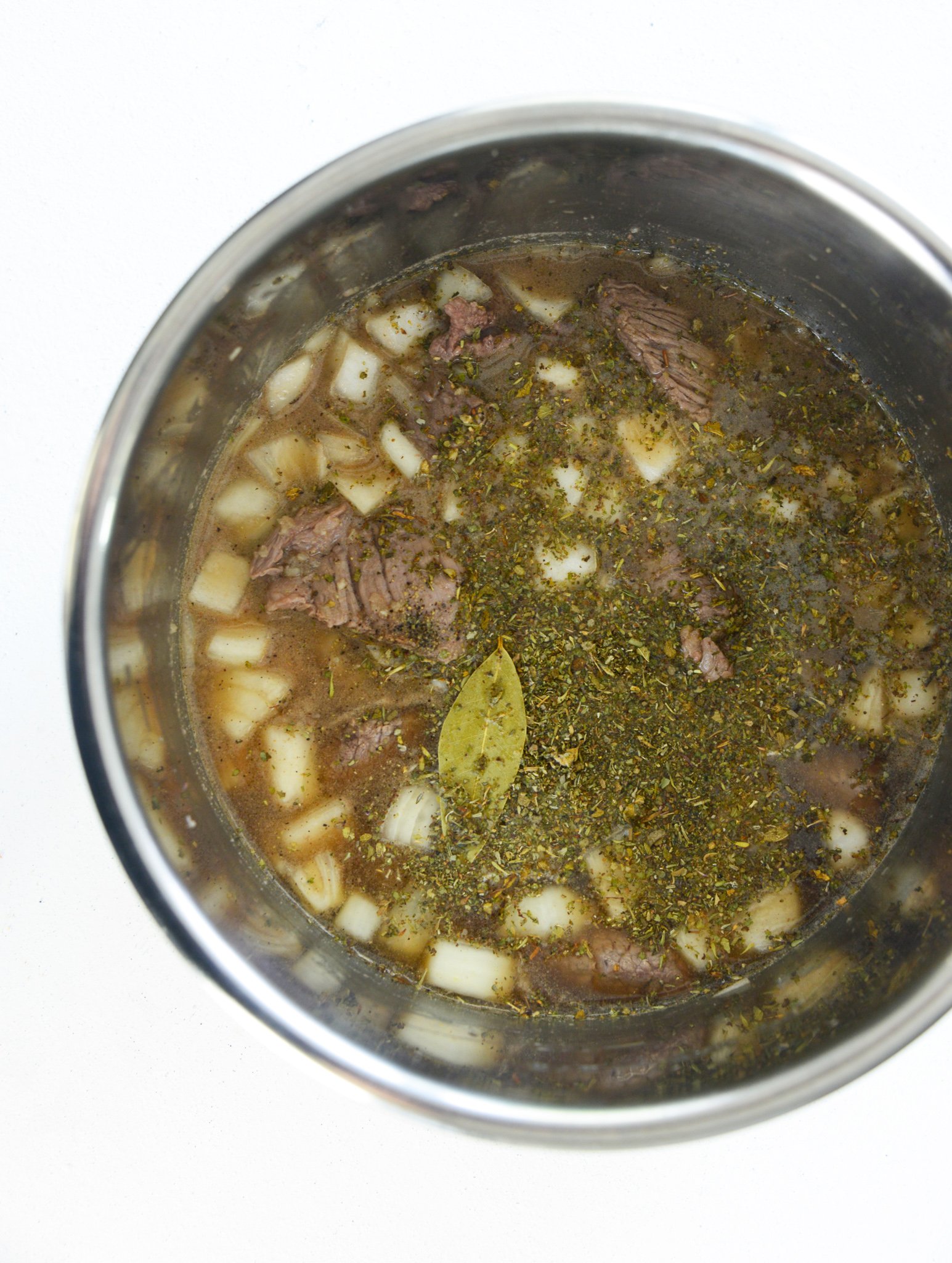 Instant Pot Beef Stew Recipe with ladle.