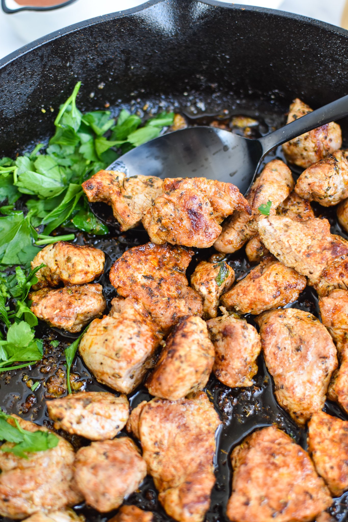 Cast Iron Pork Tenderloin in a skillet.