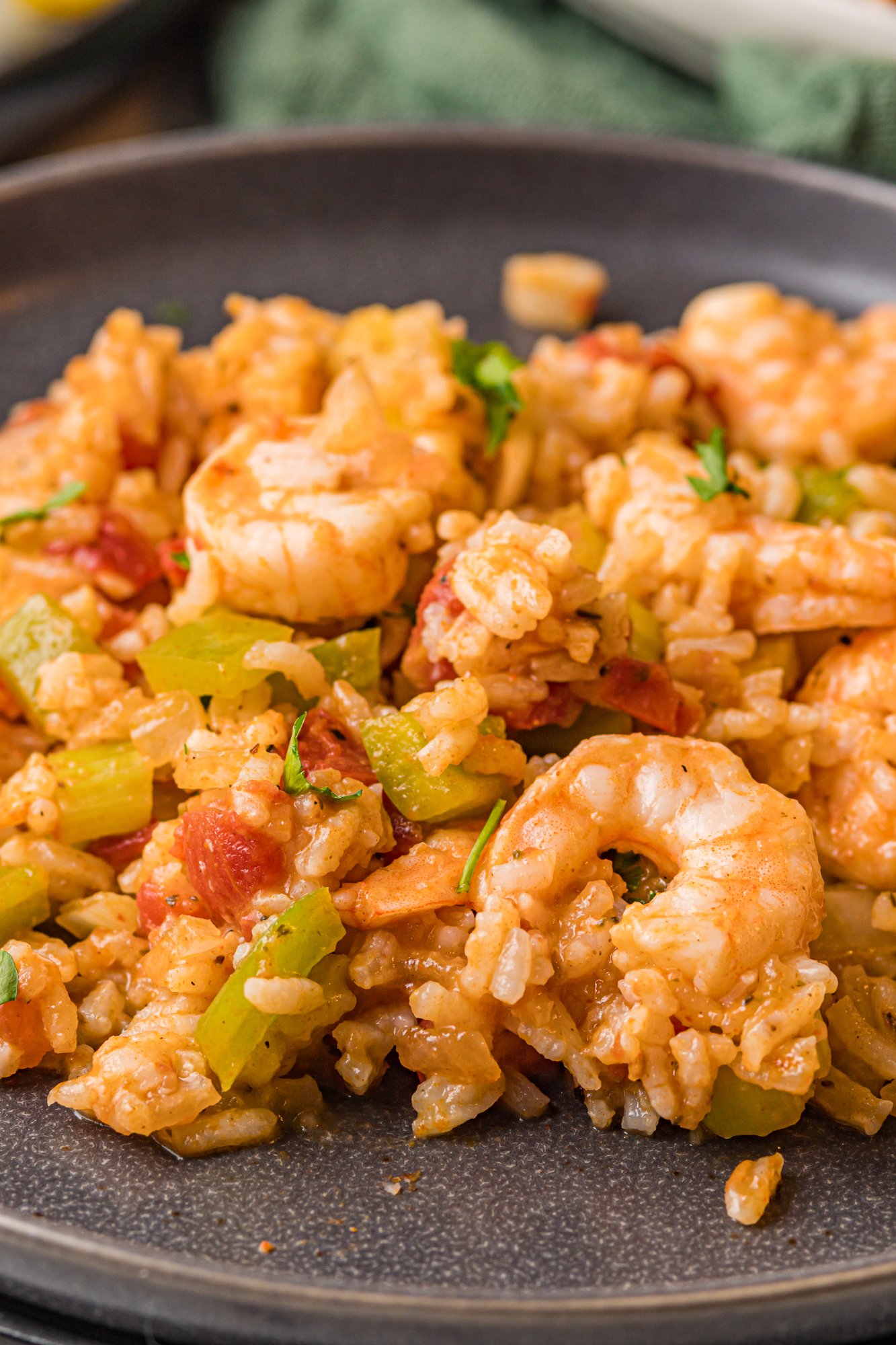 Shrimp Creole Recipe on a black plate.