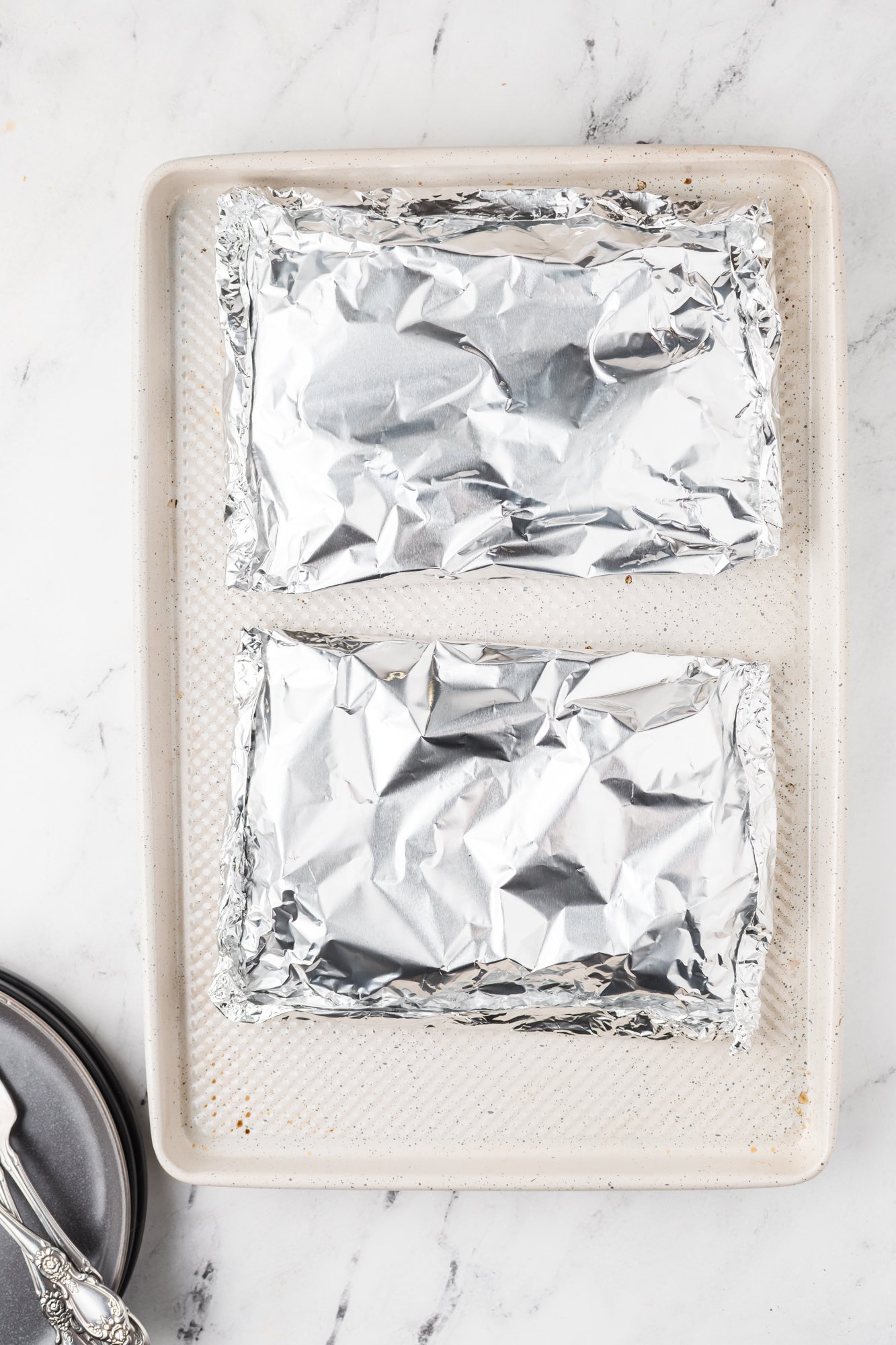 Shrimp Creole Recipe packets on baking sheet.
