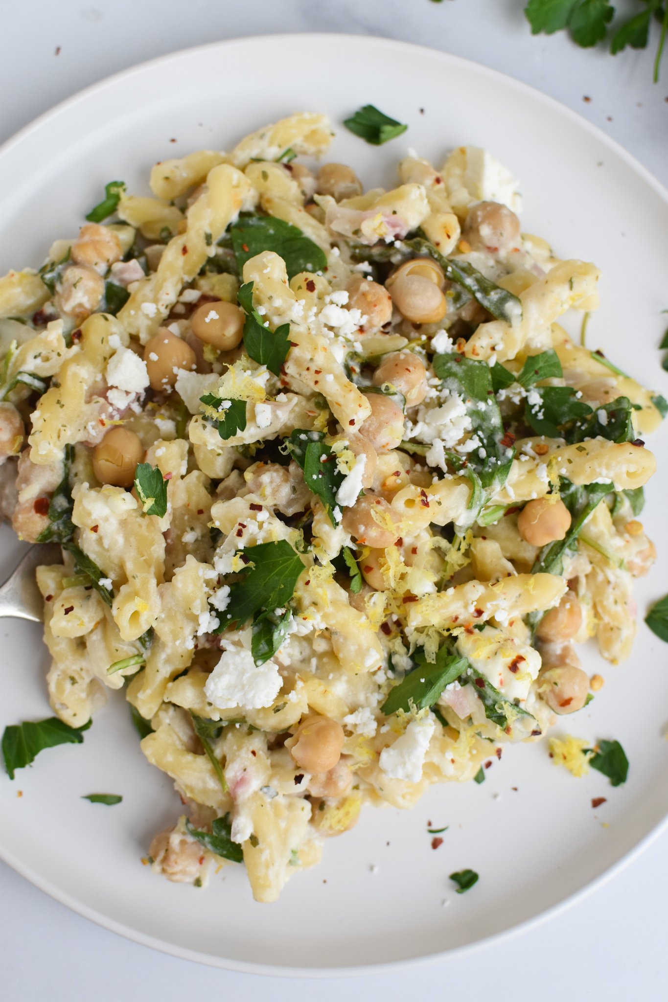 Chickpea Pasta Recipe with Feta on a white plate.