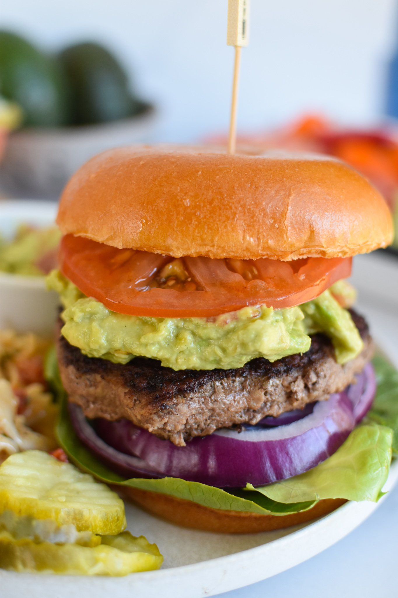 Easy Avocado Burger with bun and guacamole.