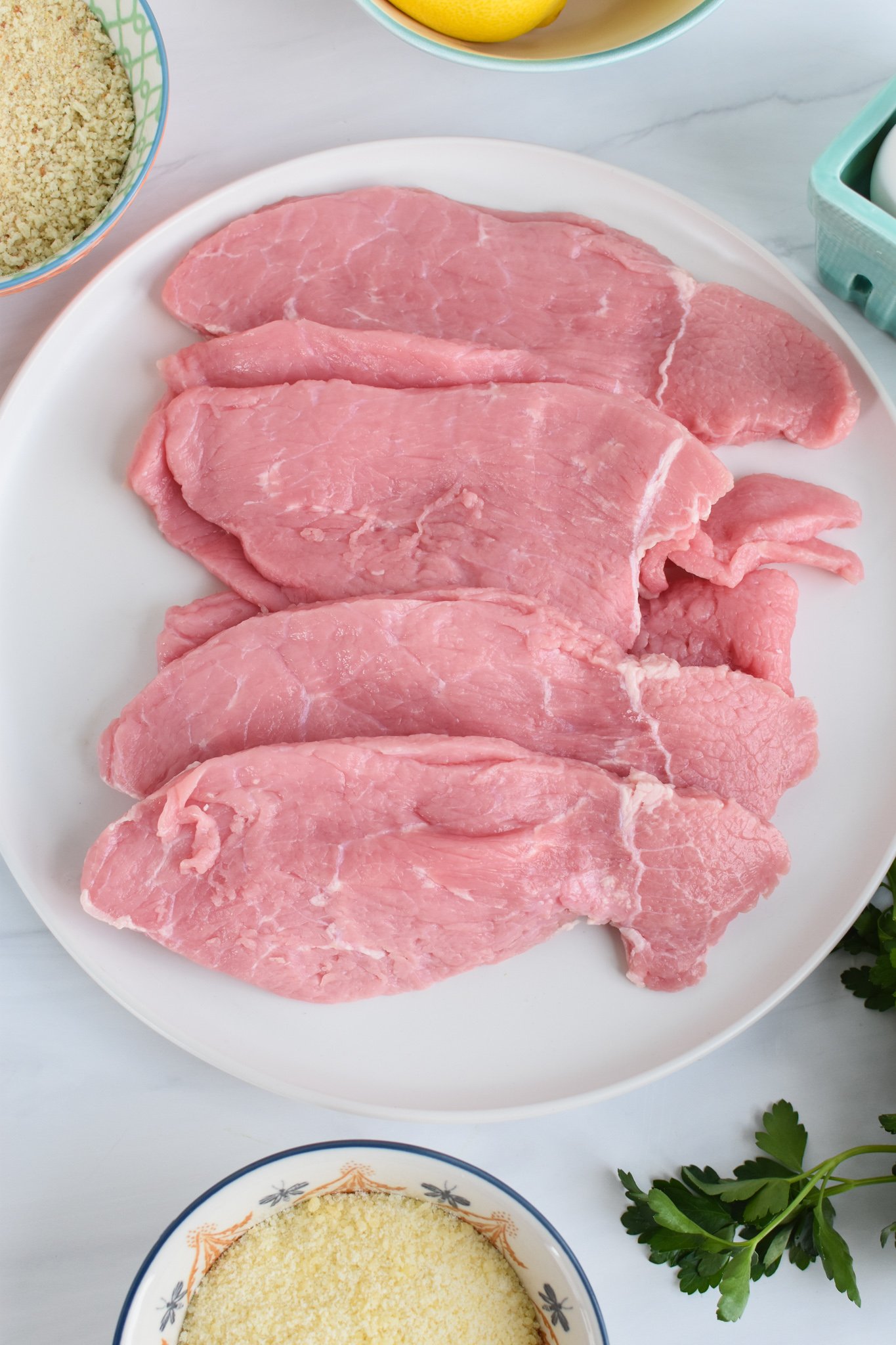 Easy Veal Milanese Recipe veal on plate.