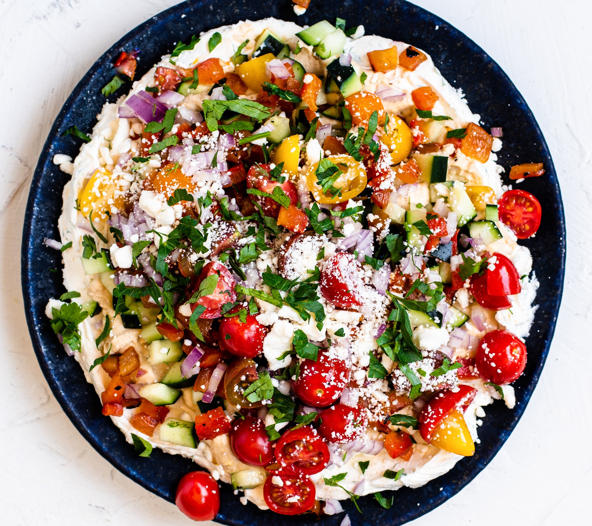 Layered Greek Dip with feta cheese.