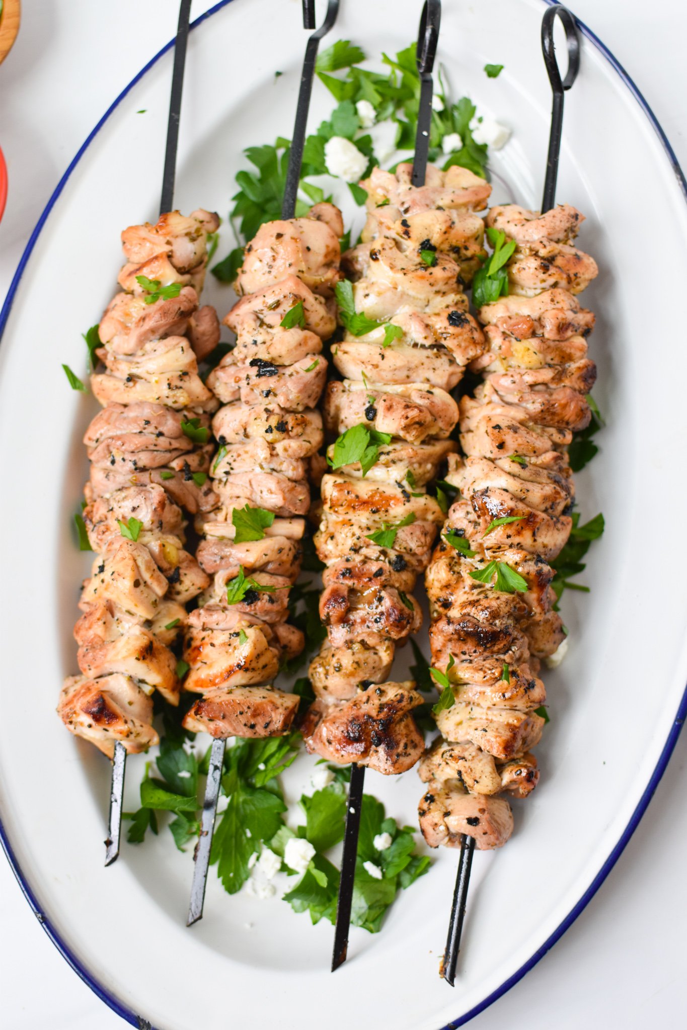 Chicken Souvlaki Recipe on a white platter.
