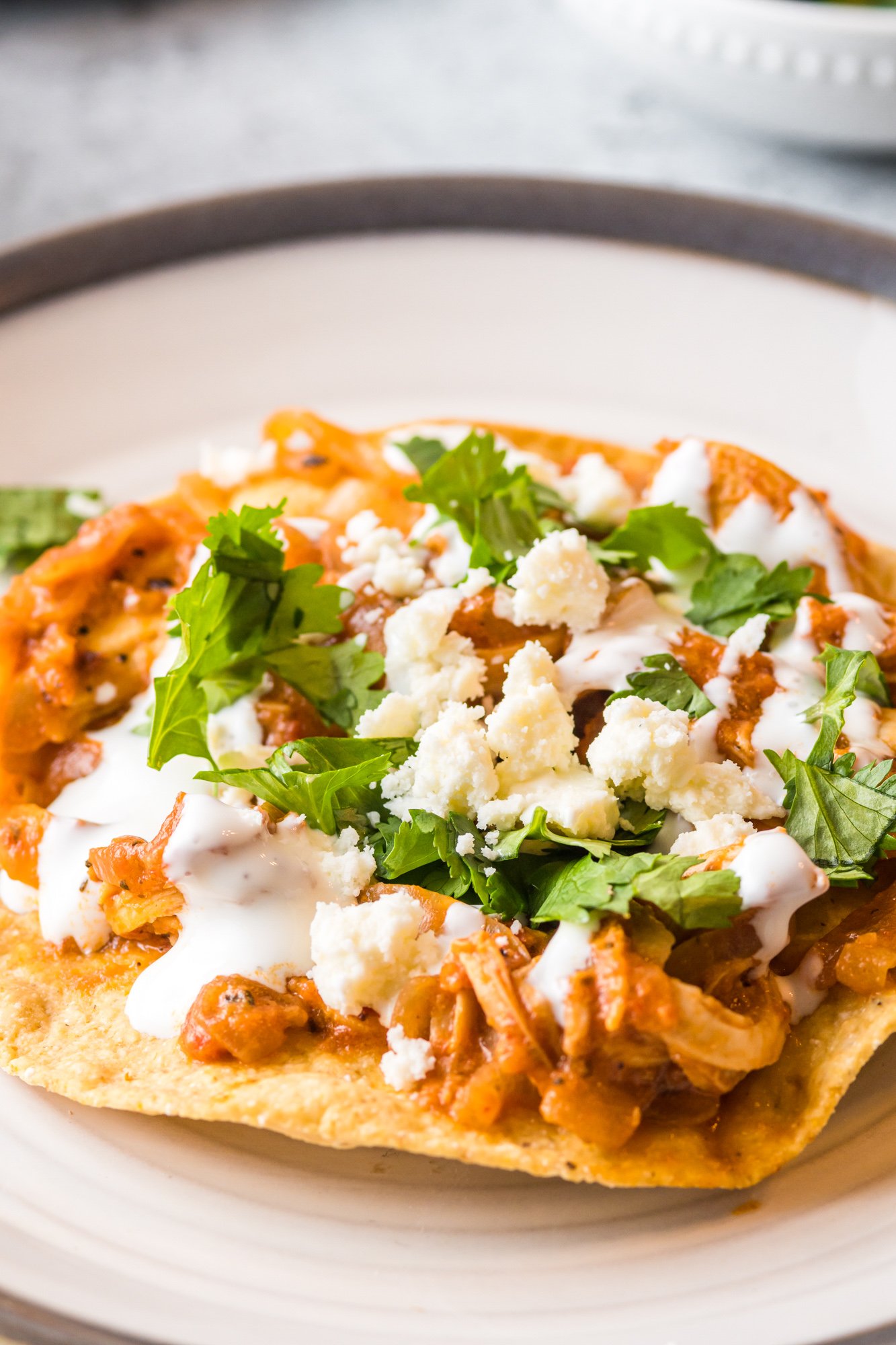 Chicken Tinga Recipe with sour cream and cilantro.