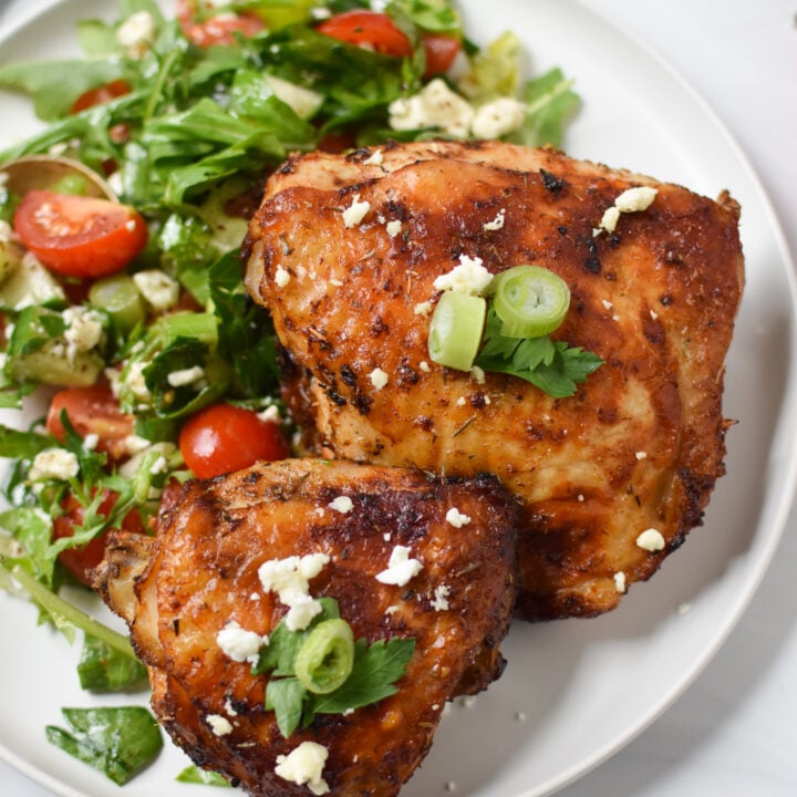 Air Fryer Mediterranean Chicken Thighs on a white plate.