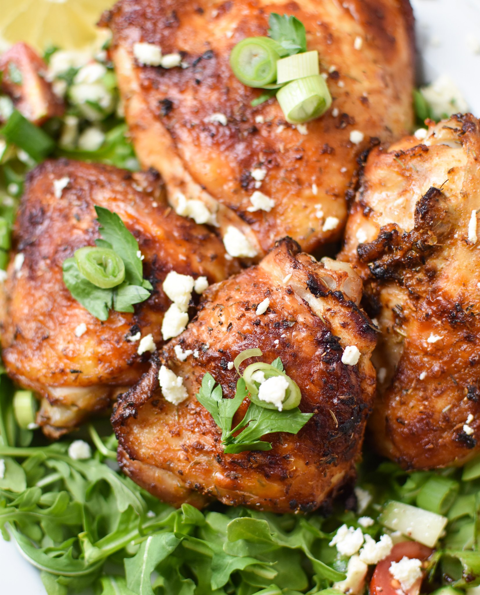 Air Fryer Mediterranean Chicken Thighs on a white platter. 