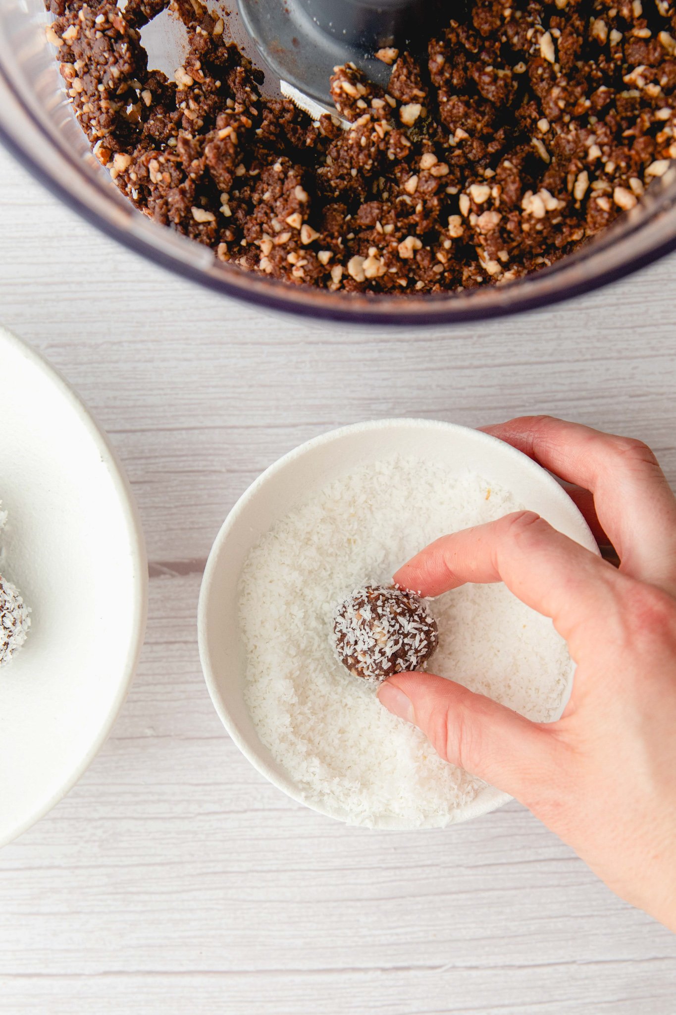Easy Date Protein Balls rolled in coconut.