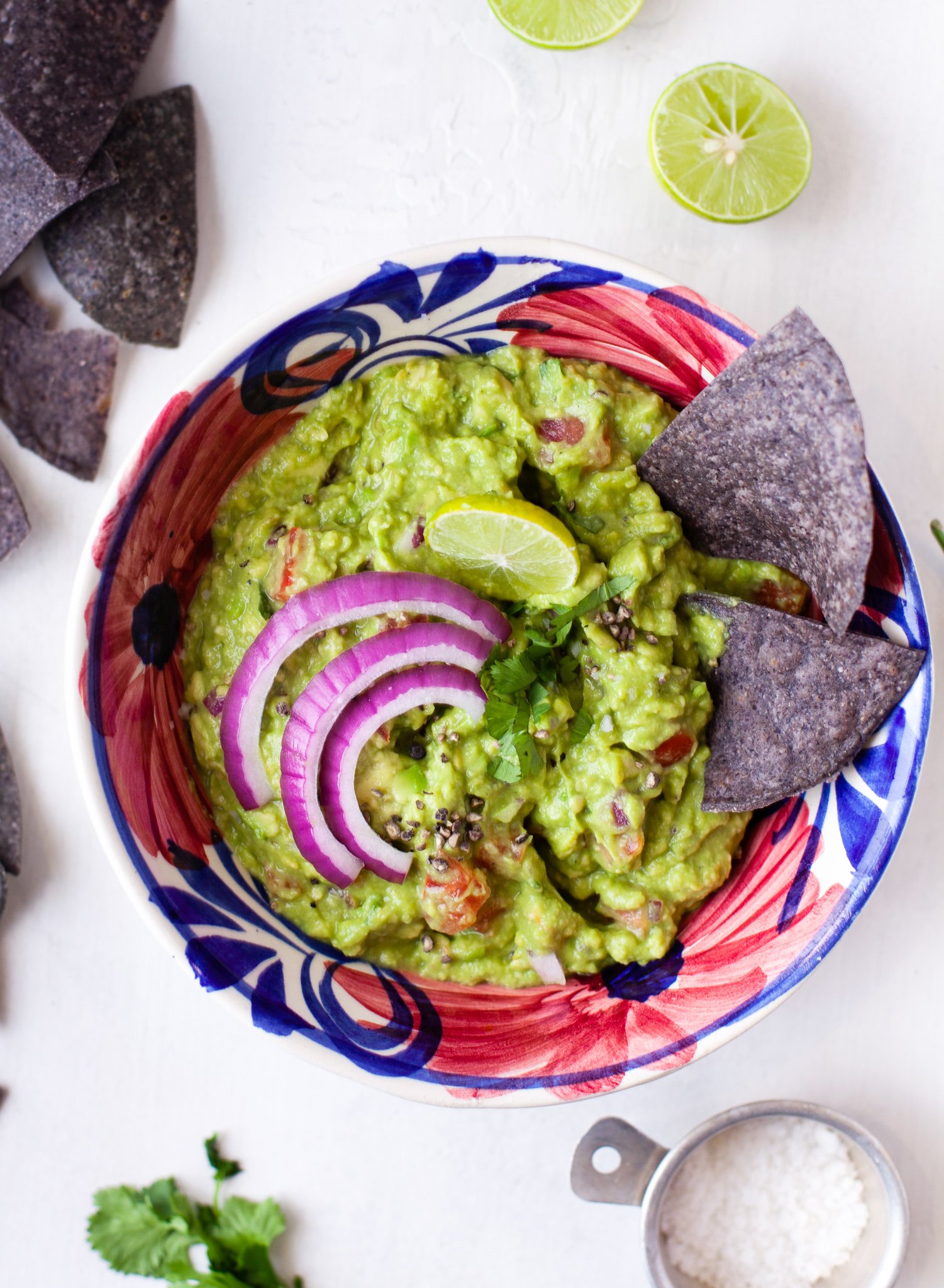 Easy Guacamole Recipe in purple bowl. 