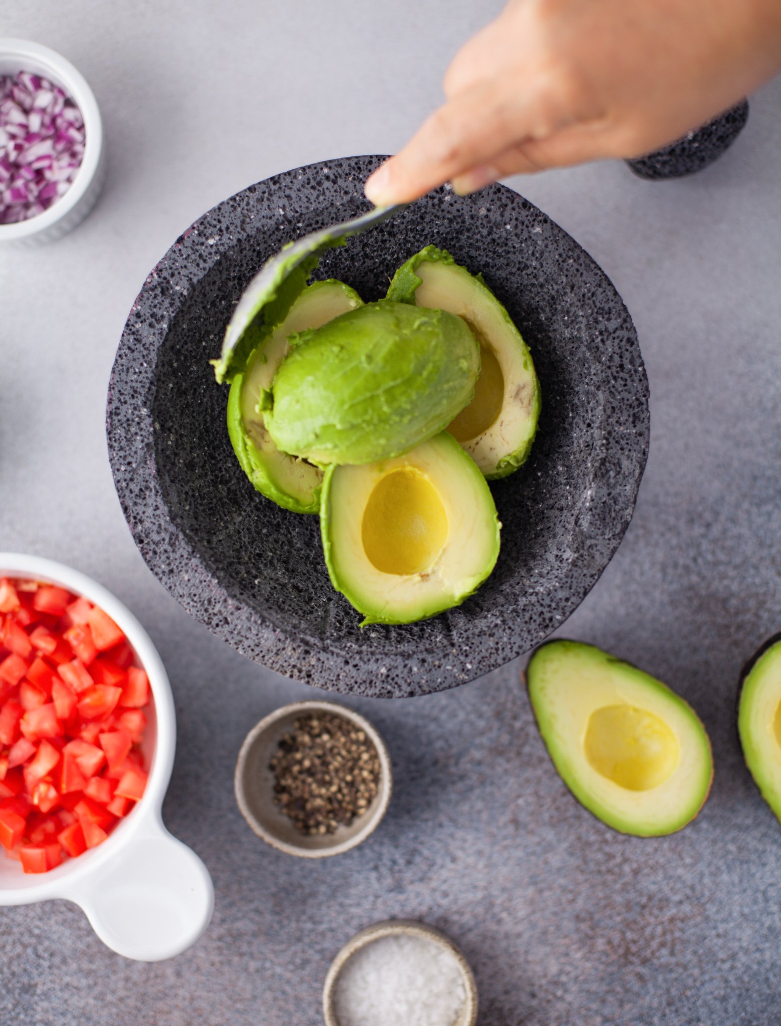 Easy Guacamole Recipe avocados with spoon. 