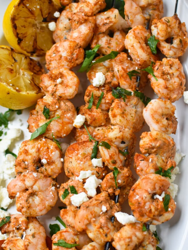 Mediterranean Grilled Shrimp Skewers on a white platter.