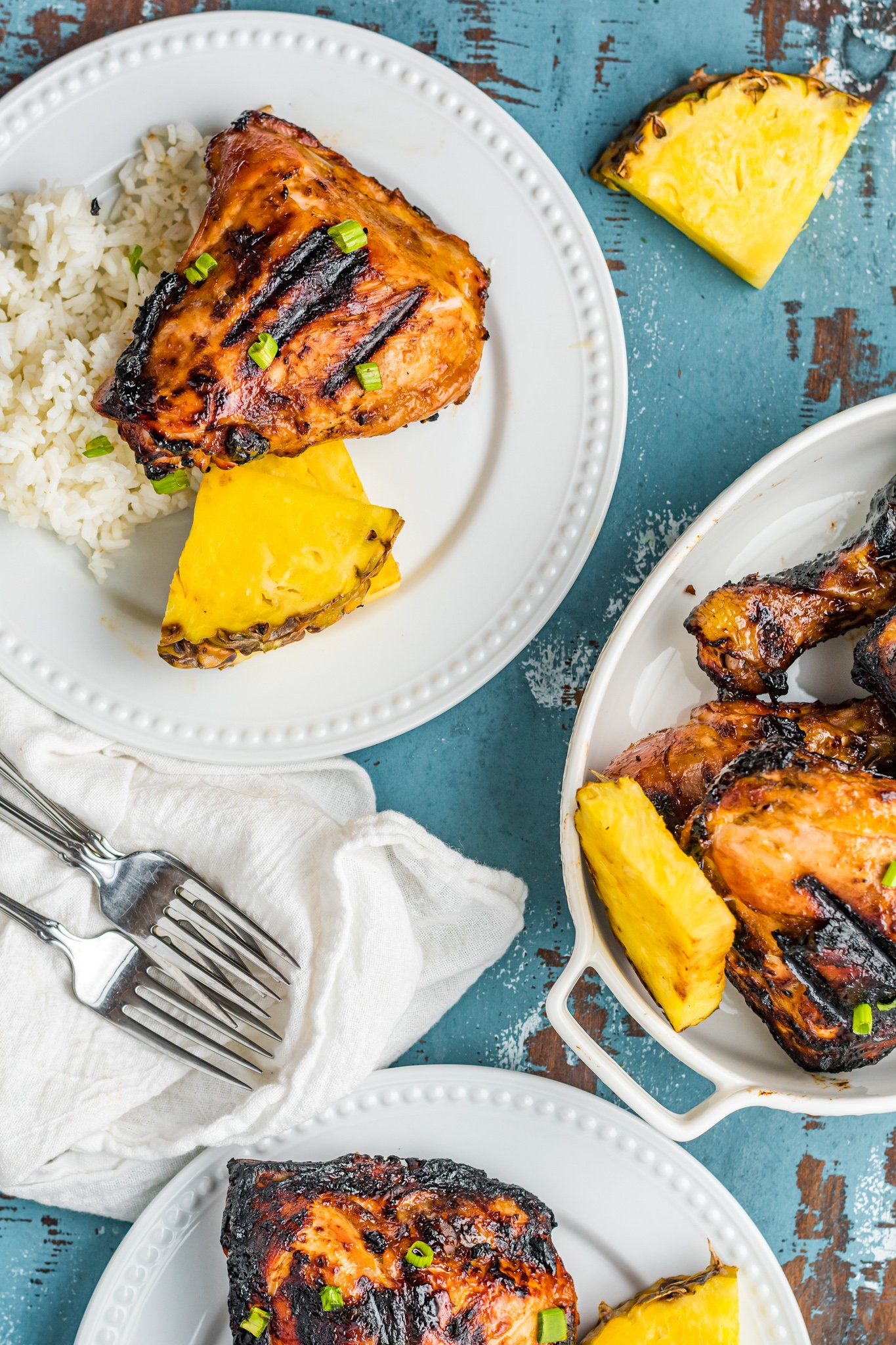 Grilled Huli Huli Chicken on white plates.