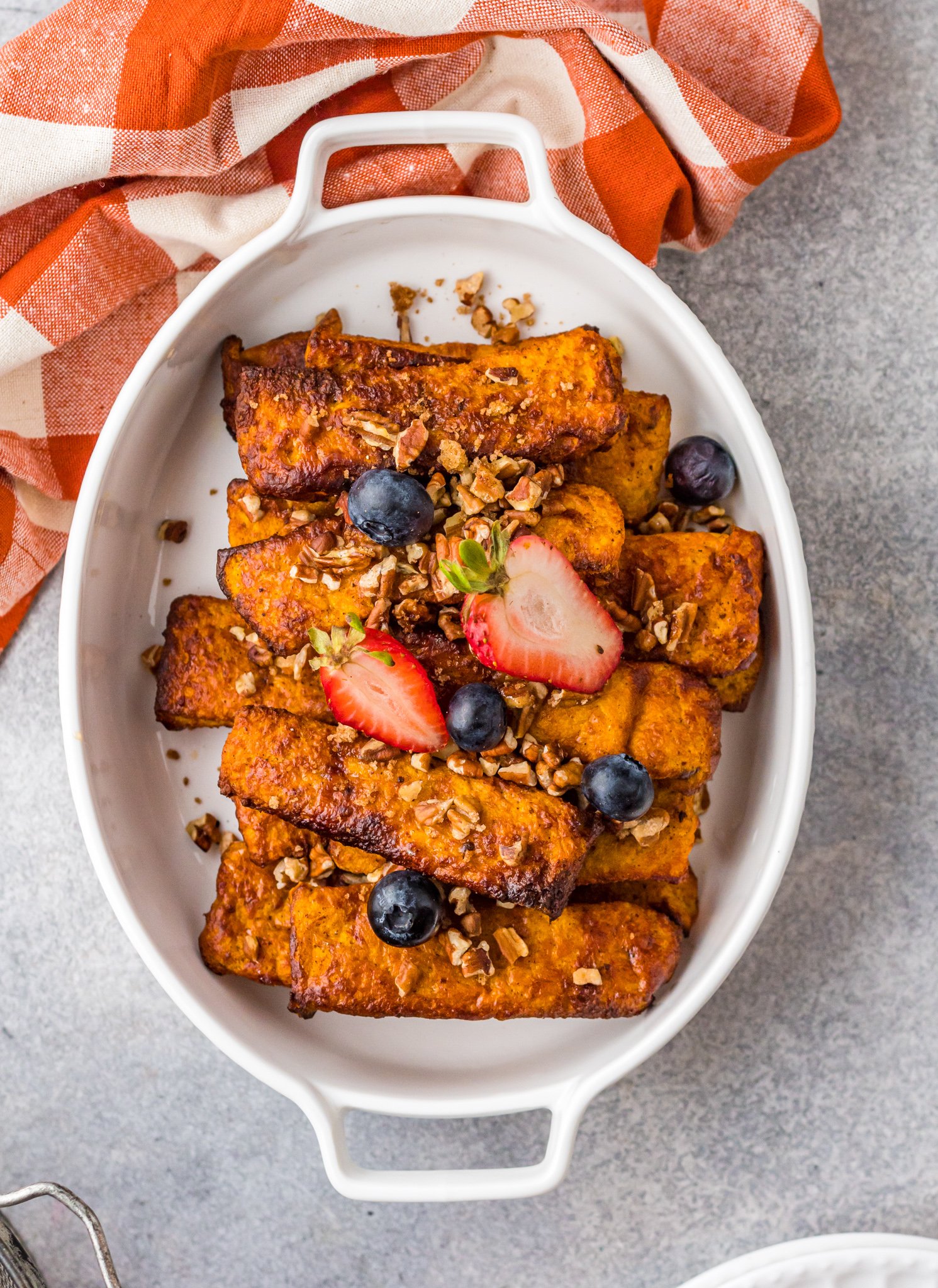 Air Fryer French Toast Sticks in casserole dish.
