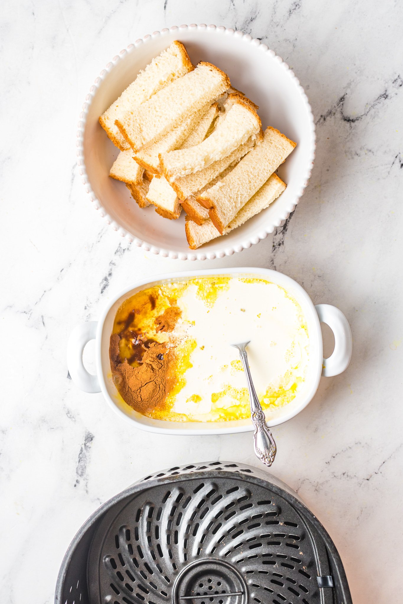Air Fryer French Toast Sticks ingredients on white counter. 
