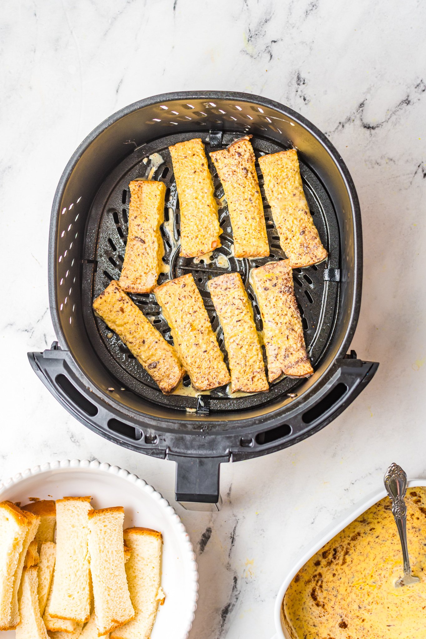 Air Fryer French Toast Sticks in air fryer.