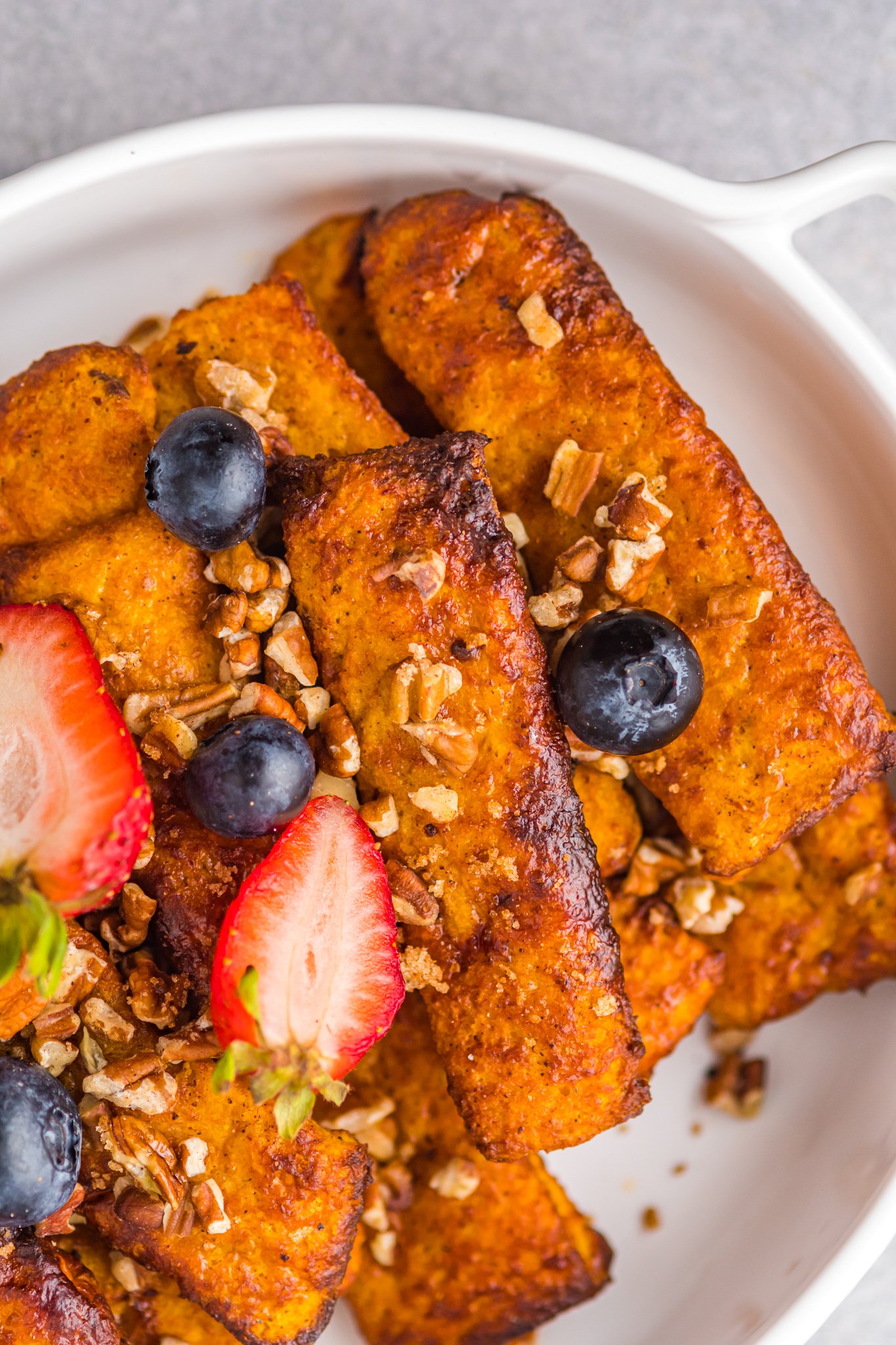 Air Fryer French Toast Sticks in a casserole dish. 