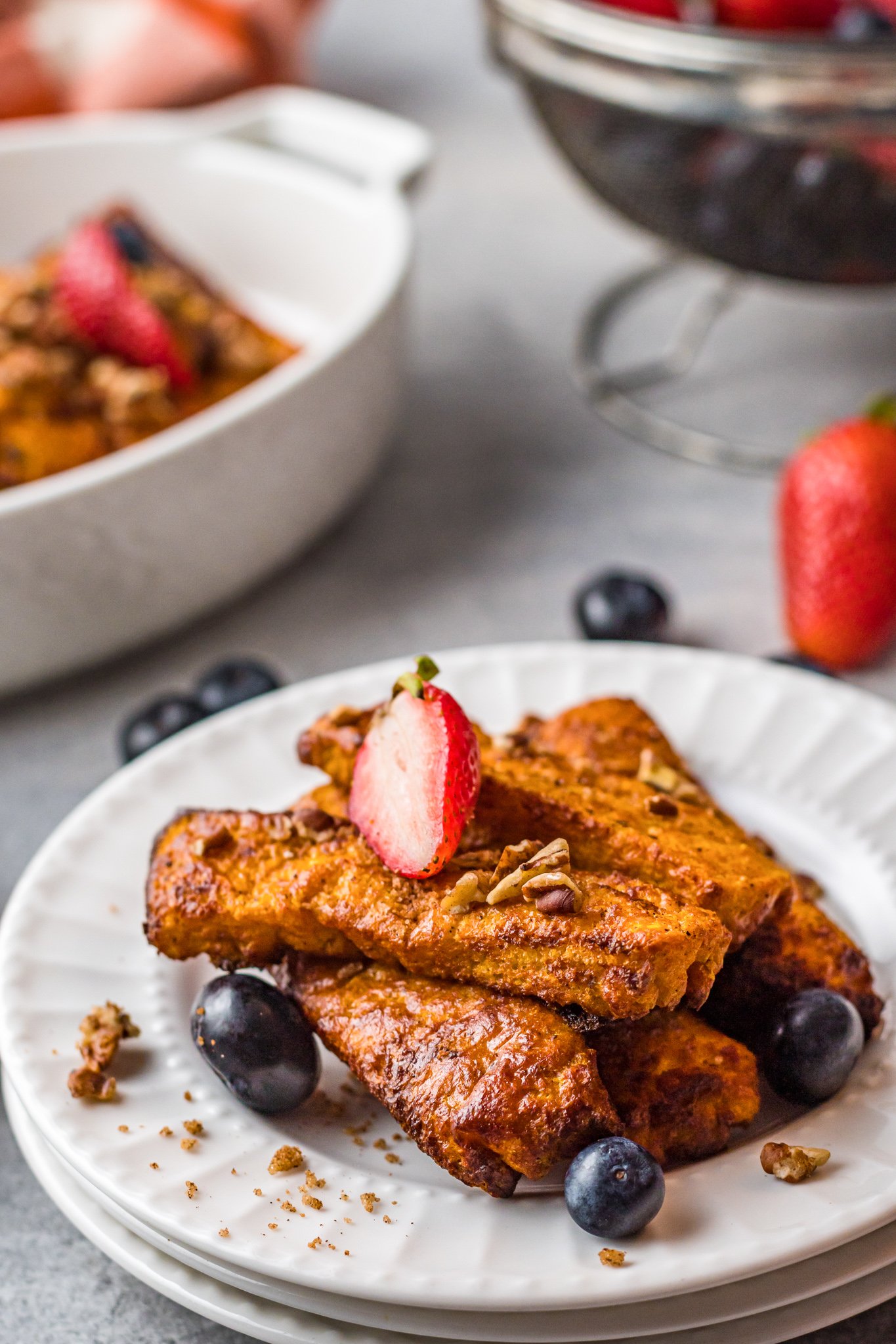 Air Fryer French Toast Sticks on a white plate. 