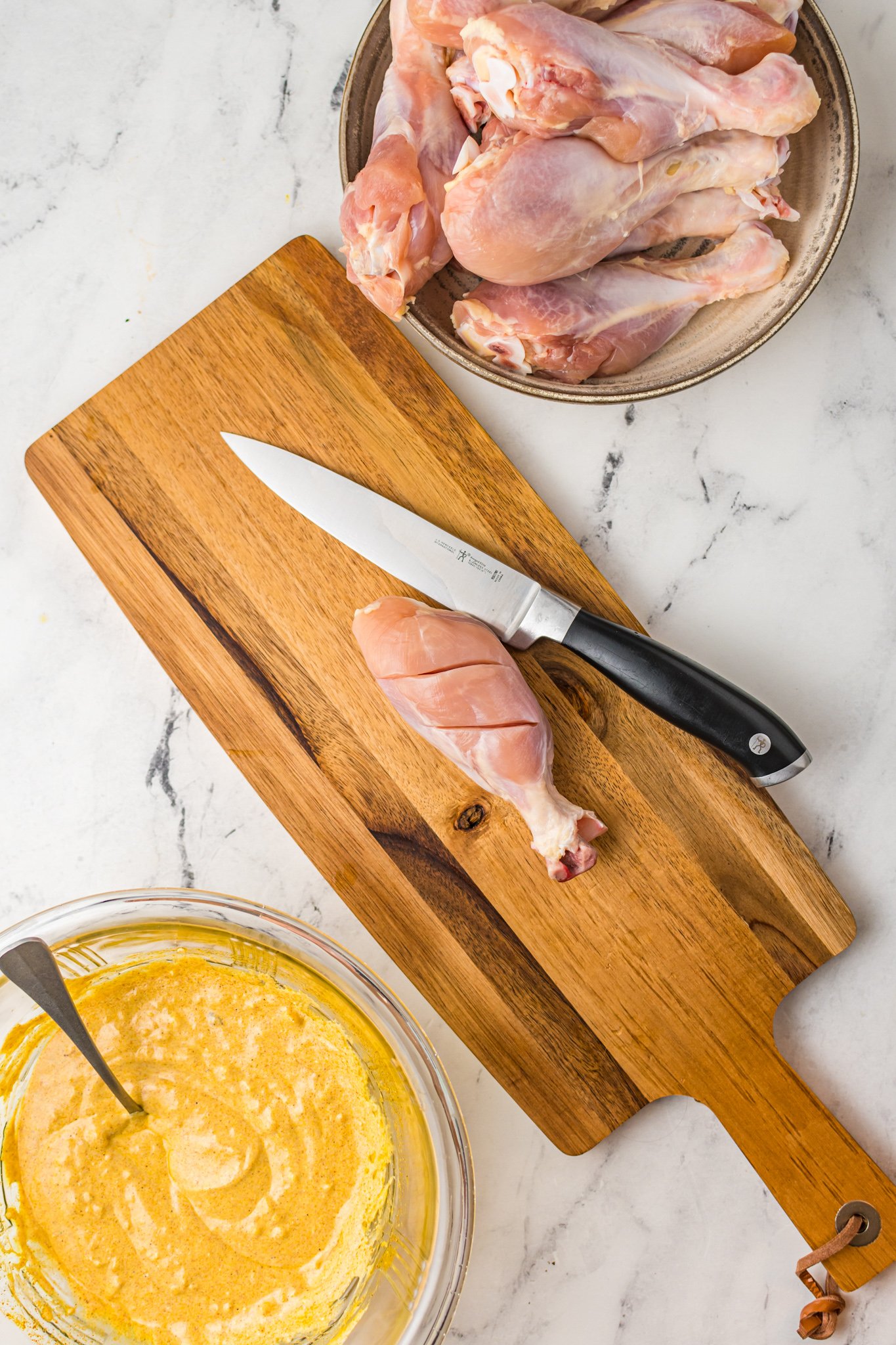 Air Fryer Tandoori Chicken Legs on cutting board. 