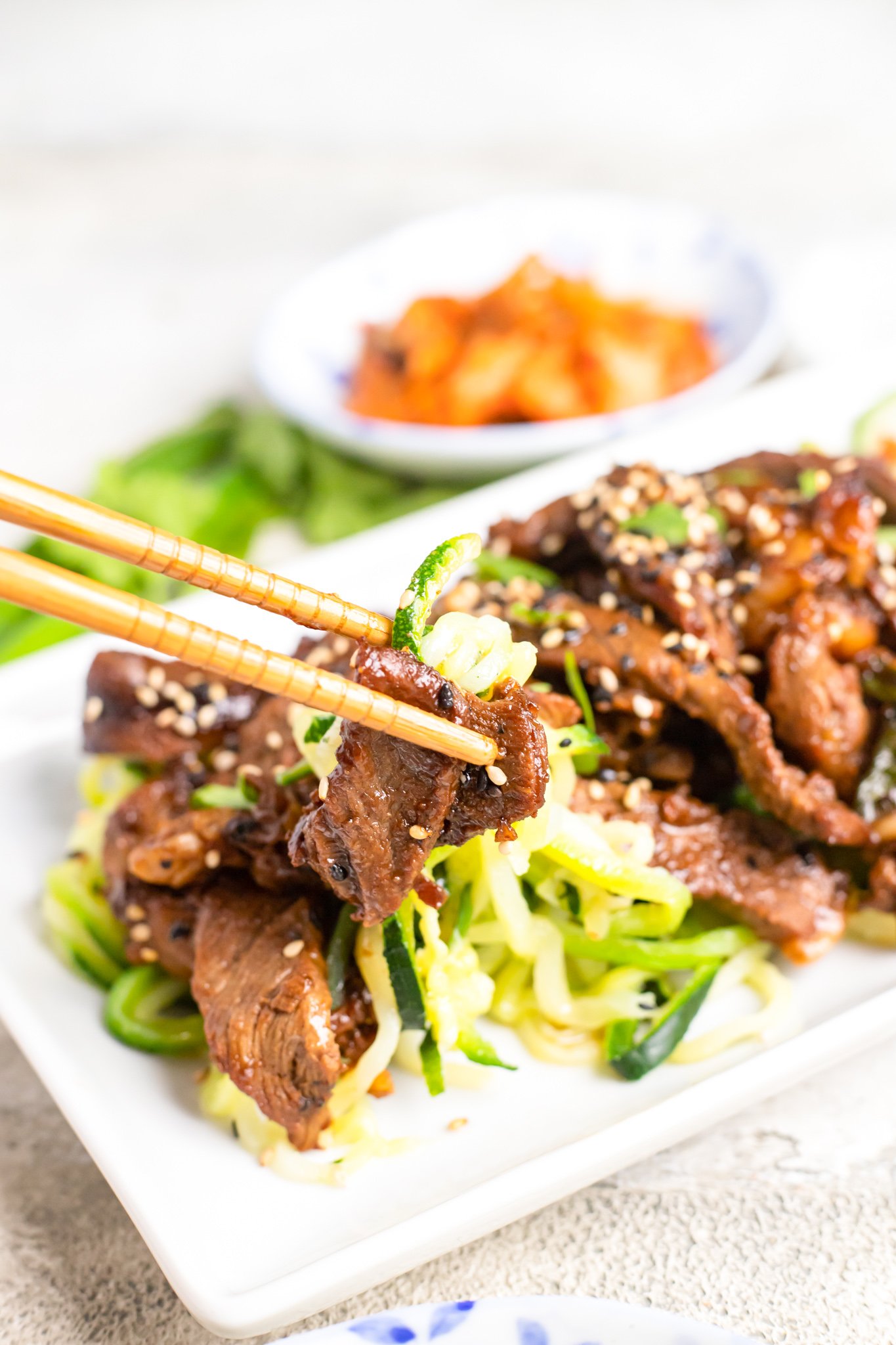 Beef Bulgogi with Zucchini Noodles with chopsticks. 