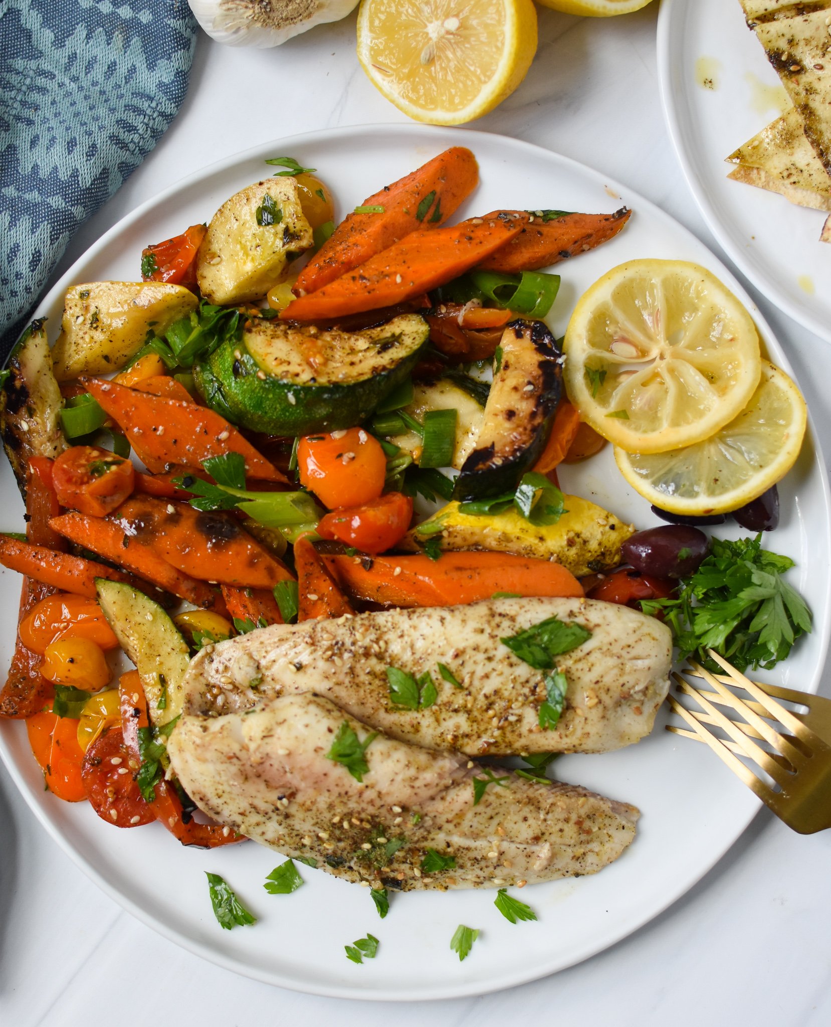 Mediterranean Baked Tilapia Recipe on plate. 