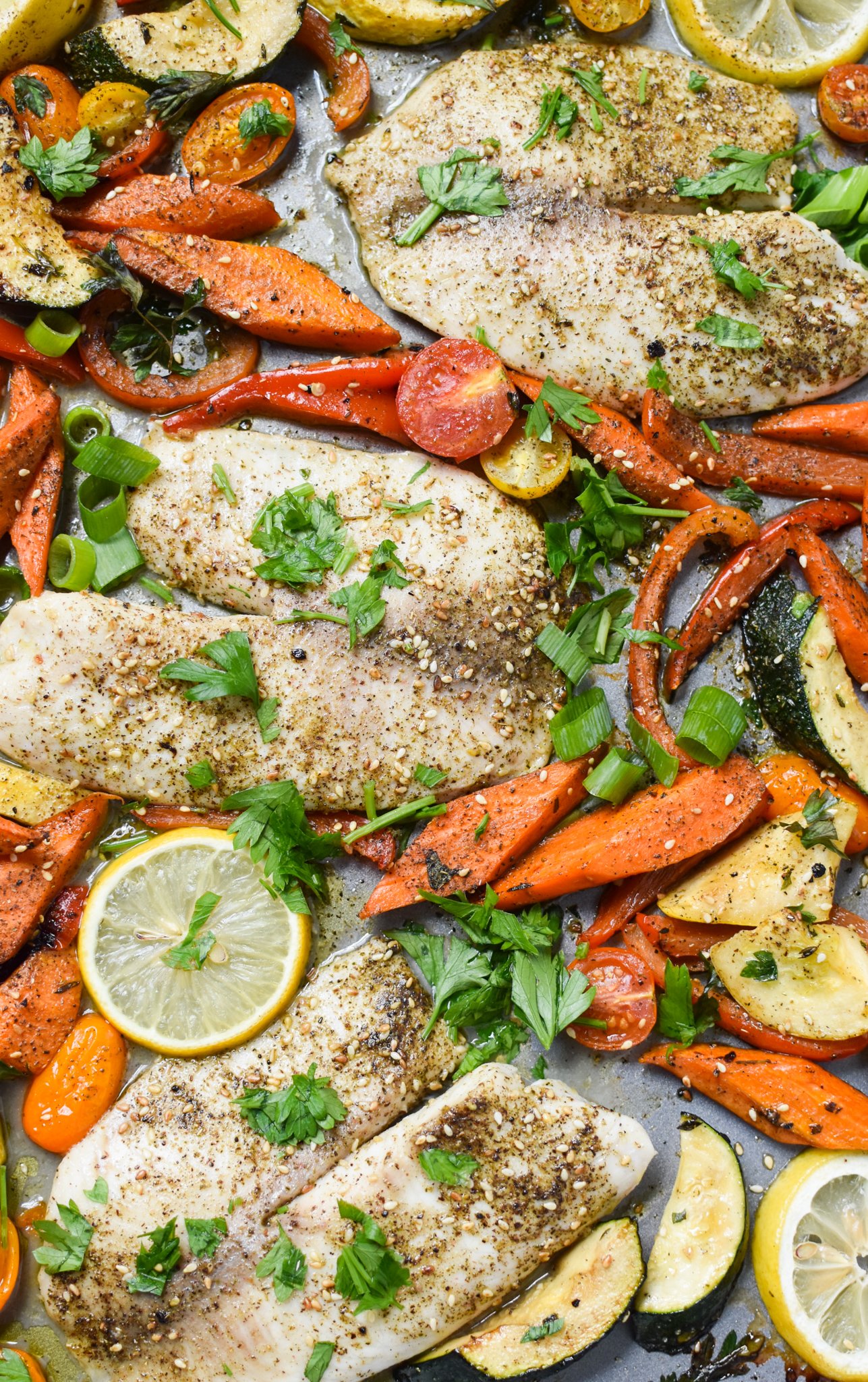 Mediterranean Baked Tilapia Recipe with lemon and vegetables. 