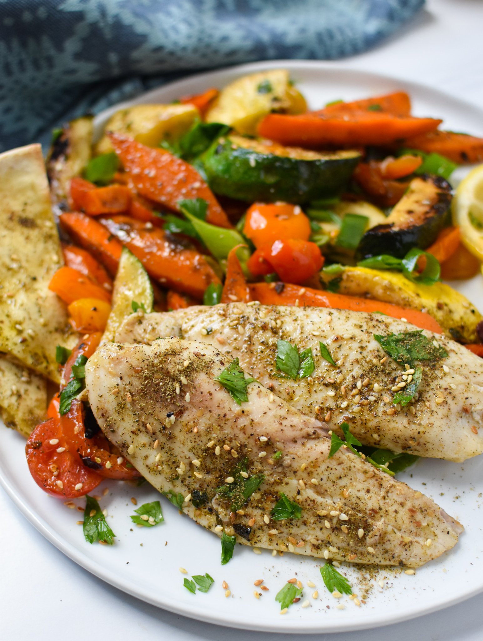 Mediterranean Baked Tilapia Recipe on a plate. 
