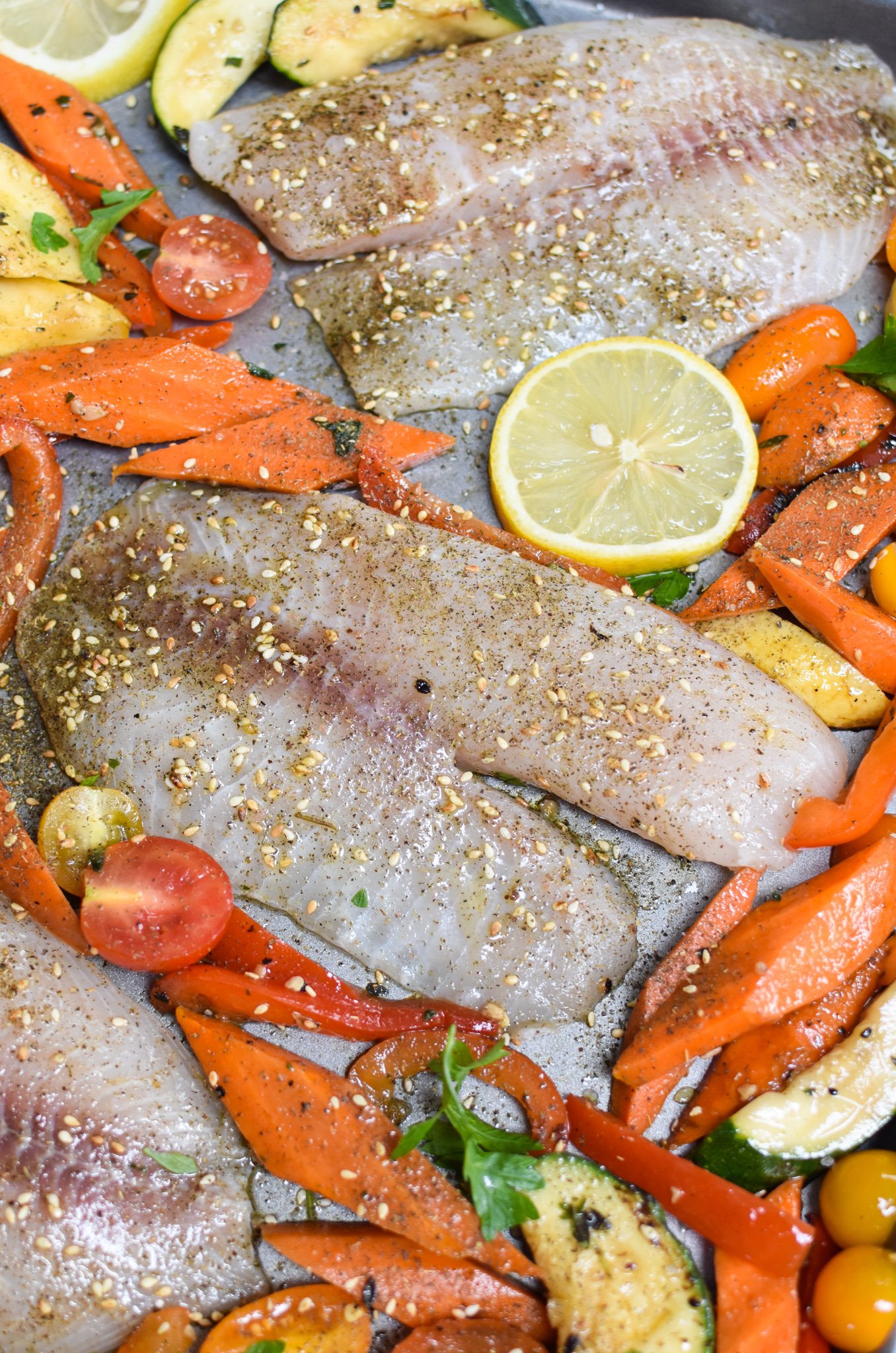 Mediterranean Baked Tilapia Recipe tilapia on baking sheet.