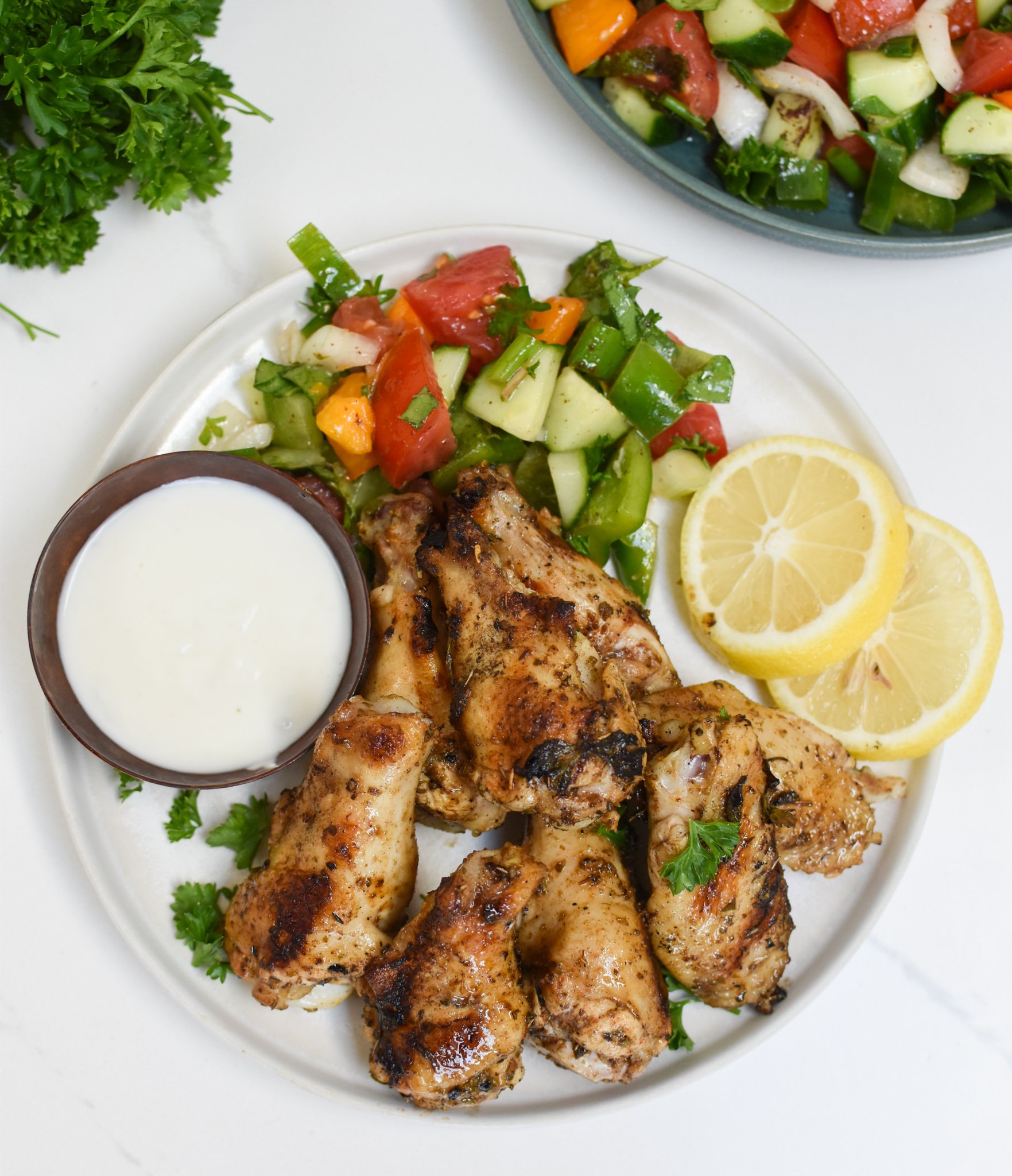 Grilled Mediterranean Chicken Wings with lemon. 