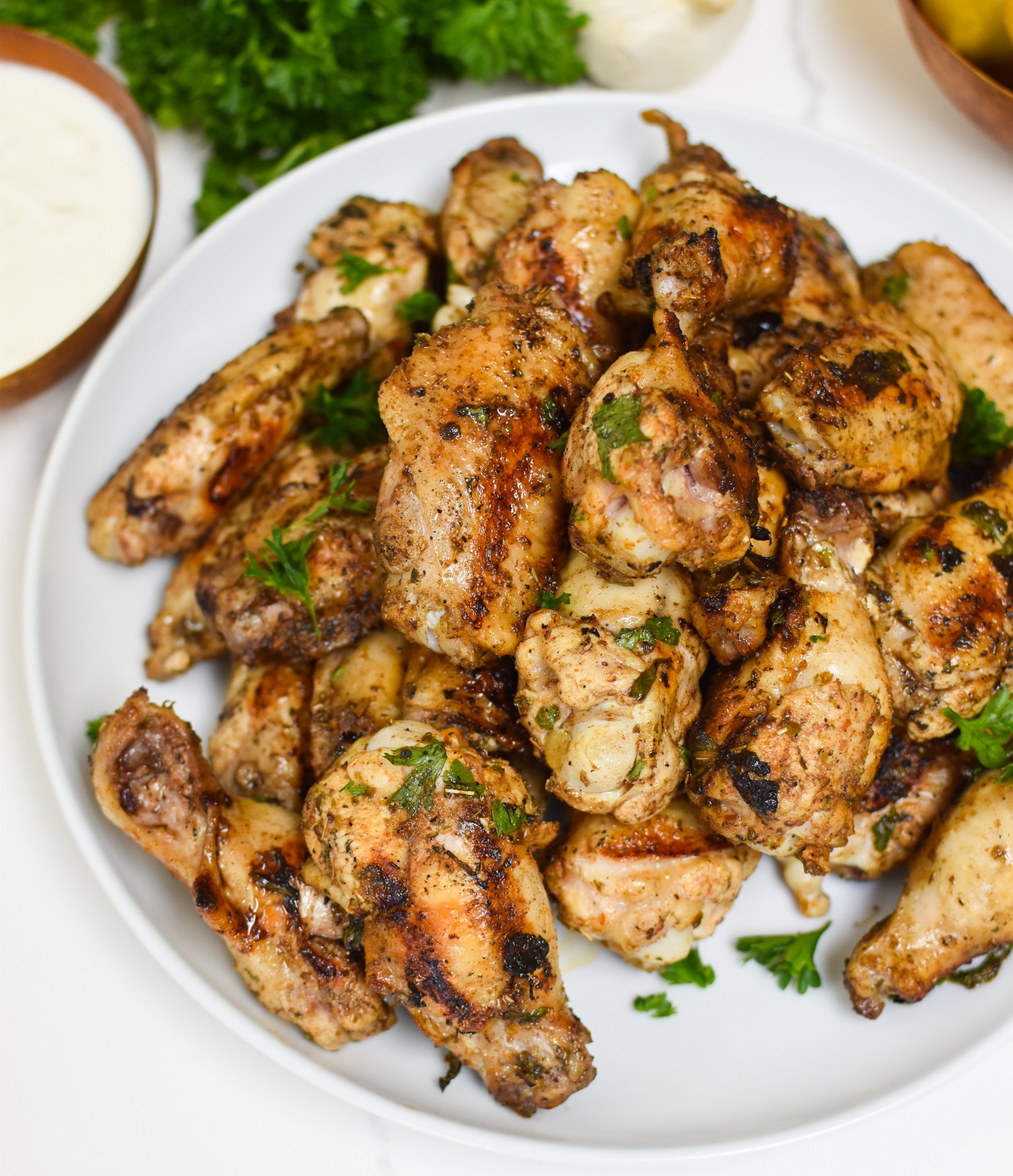 Grilled Mediterranean Chicken Wings with parsley. 