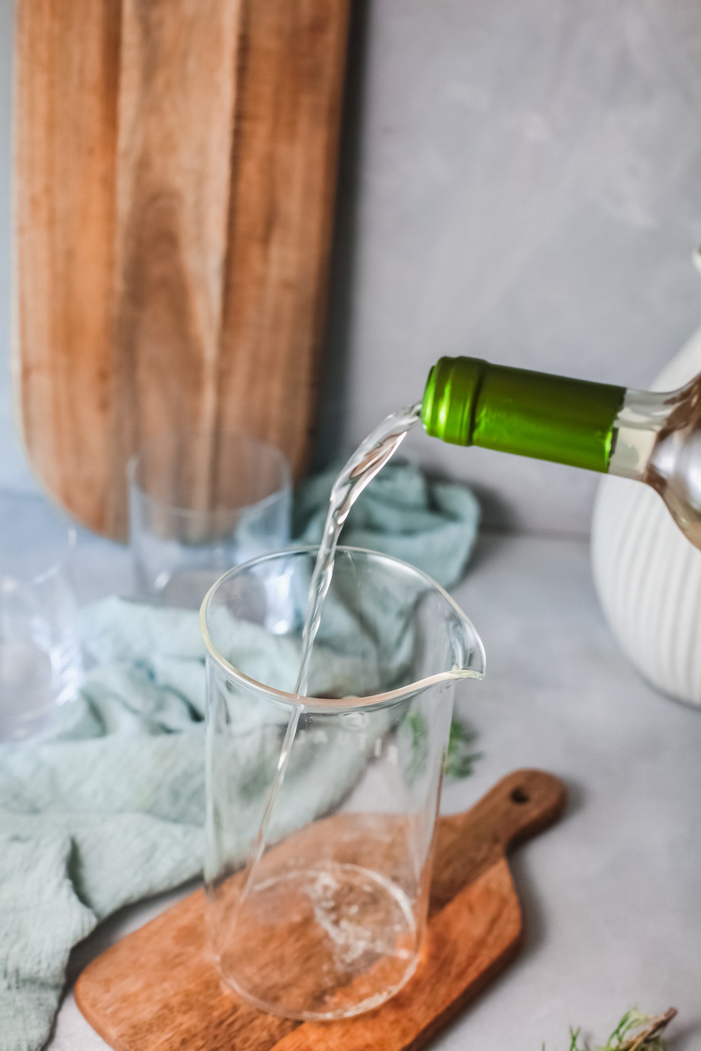 White Sangria Recipe pouring wine. 