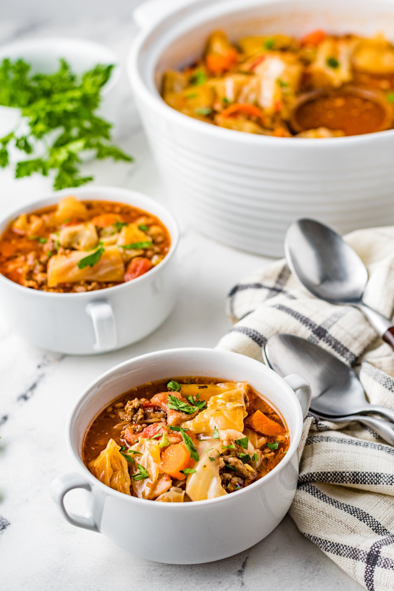 Cabbage Roll Soup in small white bowls. 